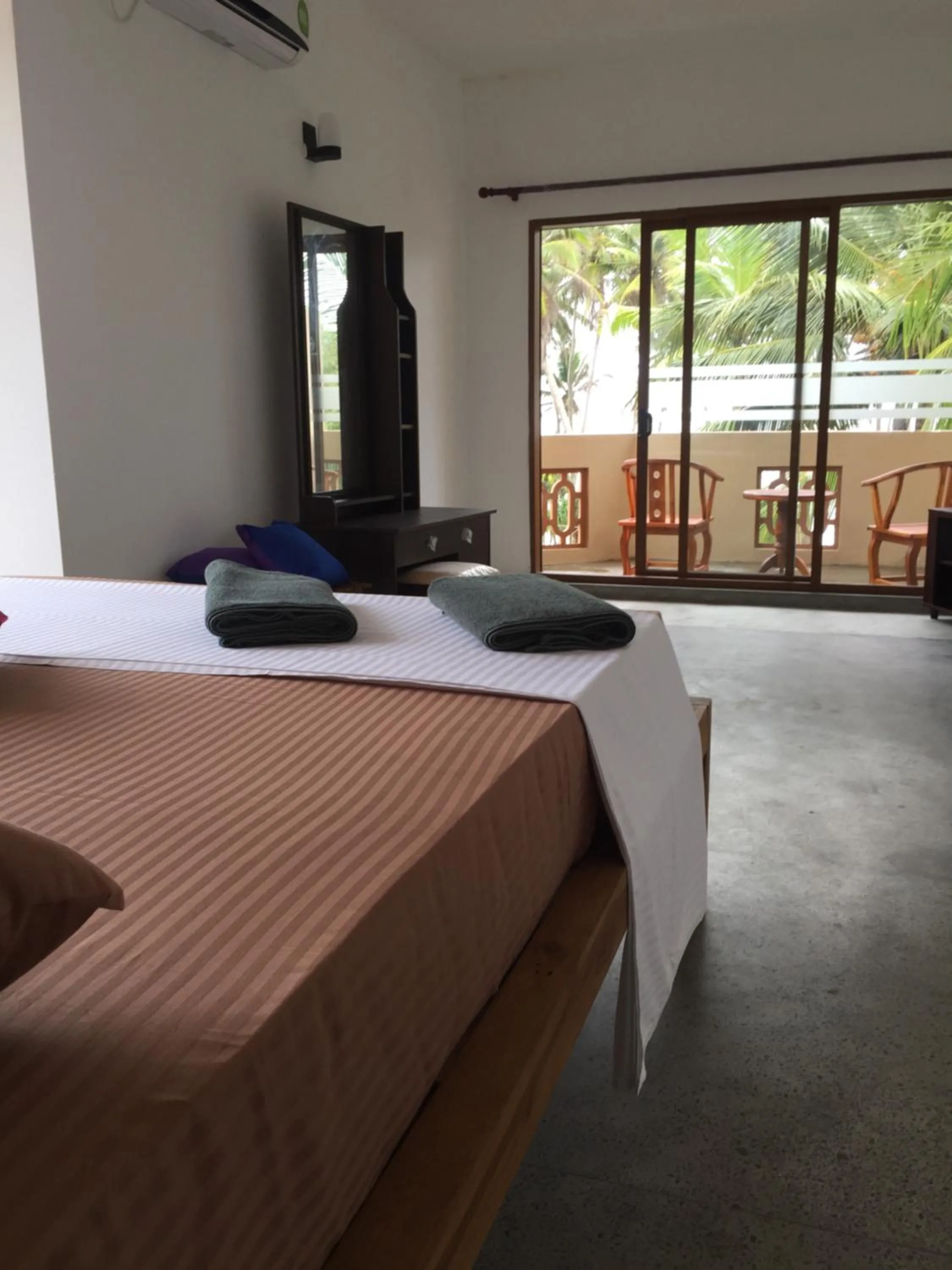 Bed in Surf Lanka Hotel