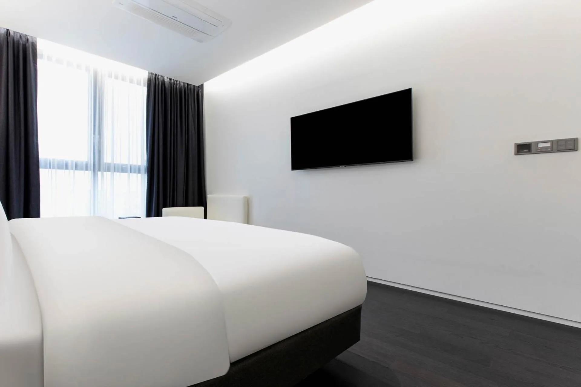 Bed in La Scene Hotel