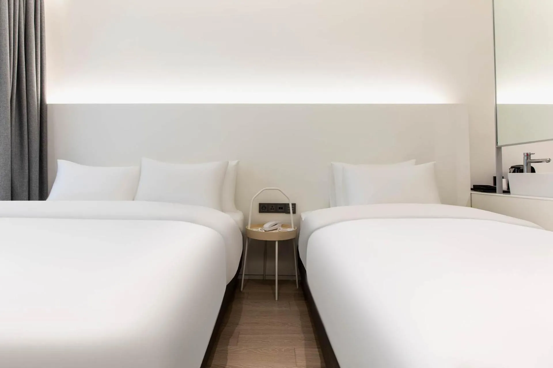 Bed in La Scene Hotel