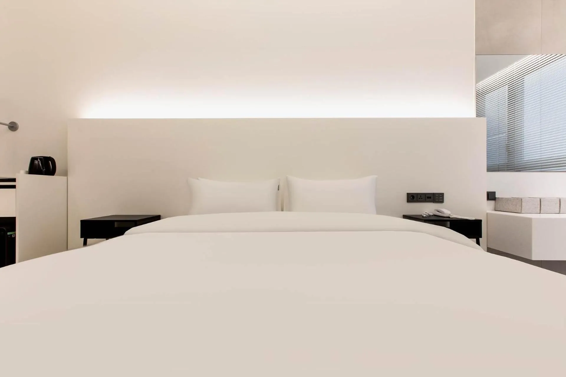 Bed in La Scene Hotel