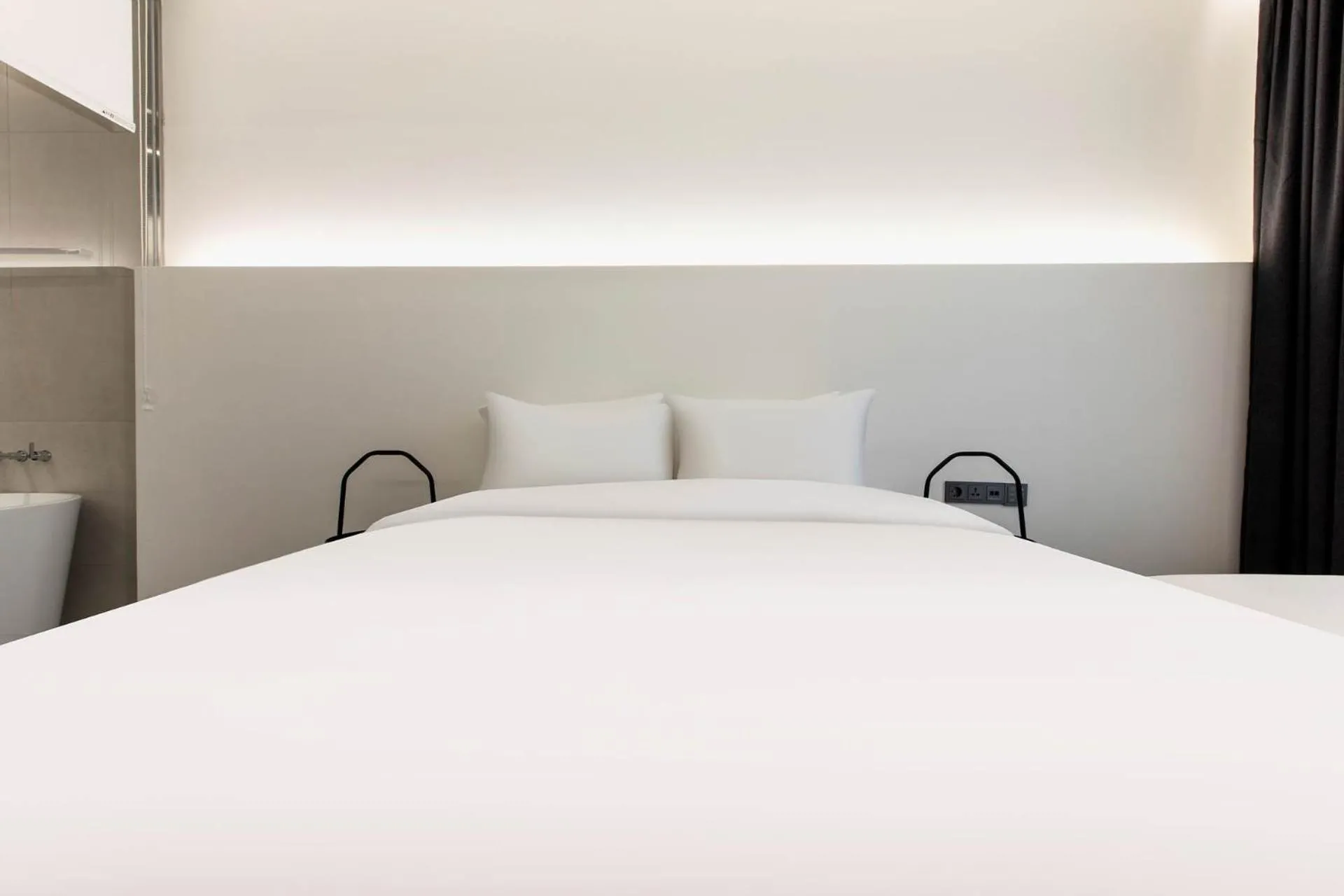 Bed in La Scene Hotel
