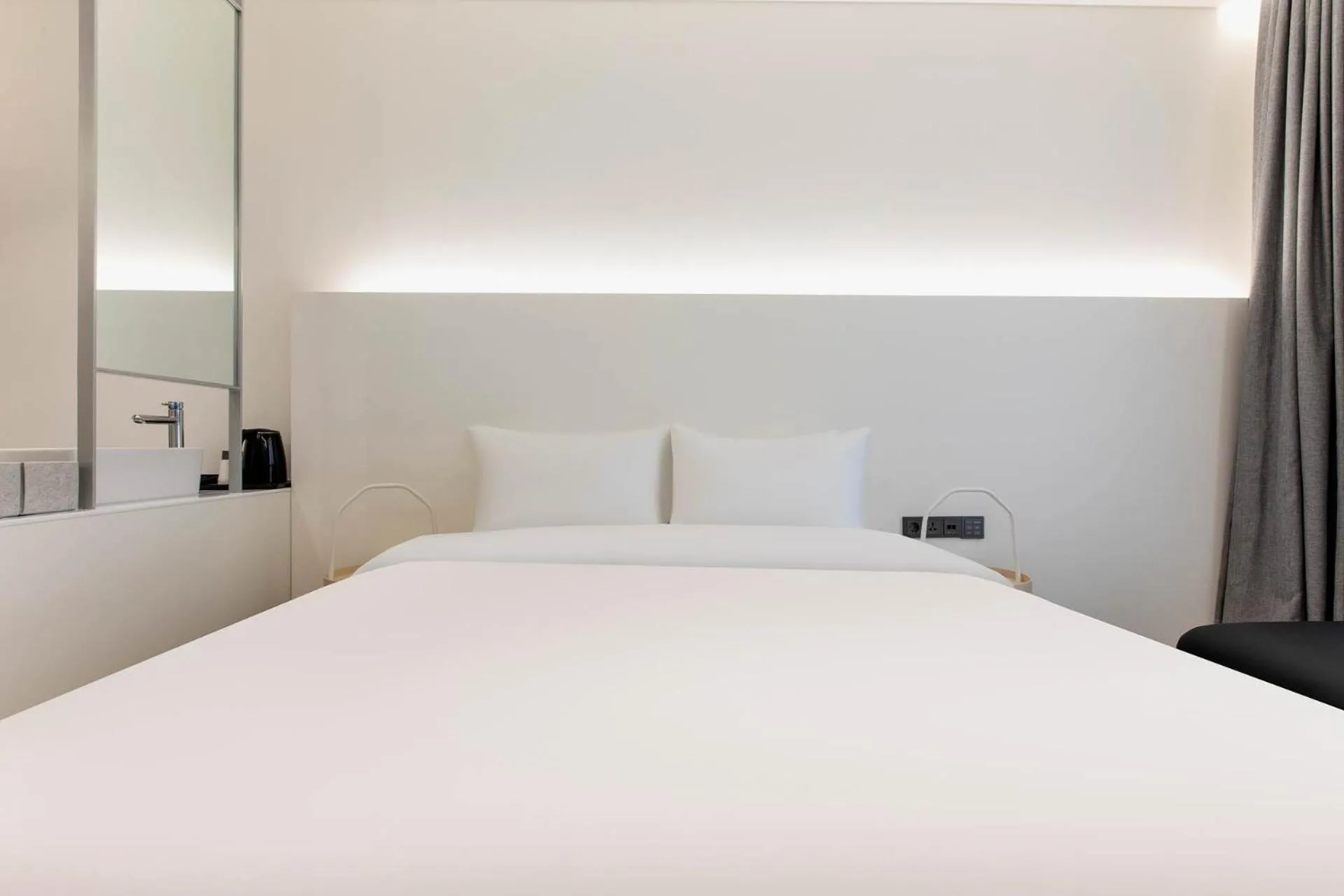 Bed in La Scene Hotel