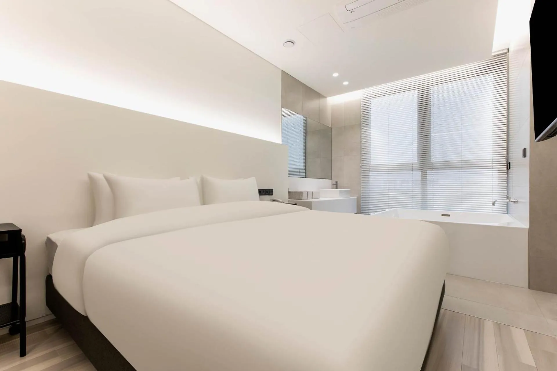 Bed in La Scene Hotel