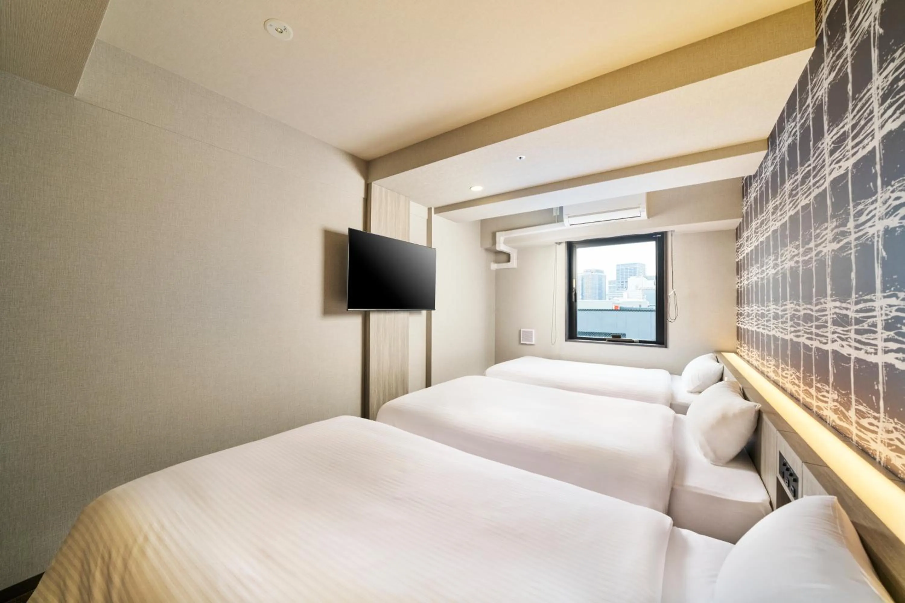 Photo of the whole room, Bed in KOKO HOTEL Osaka Namba Sennichimae