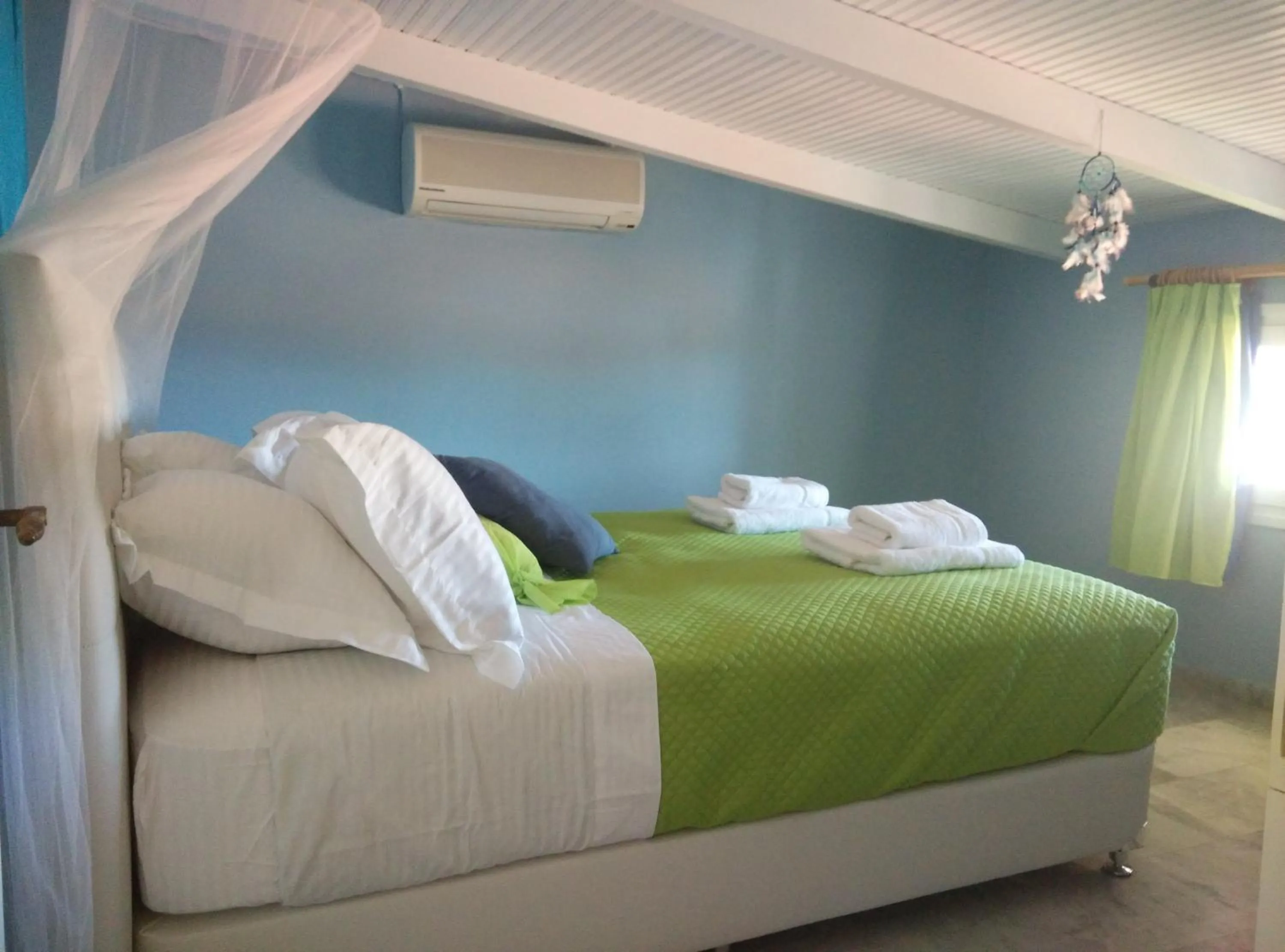 Bed in Poseidon Apartments