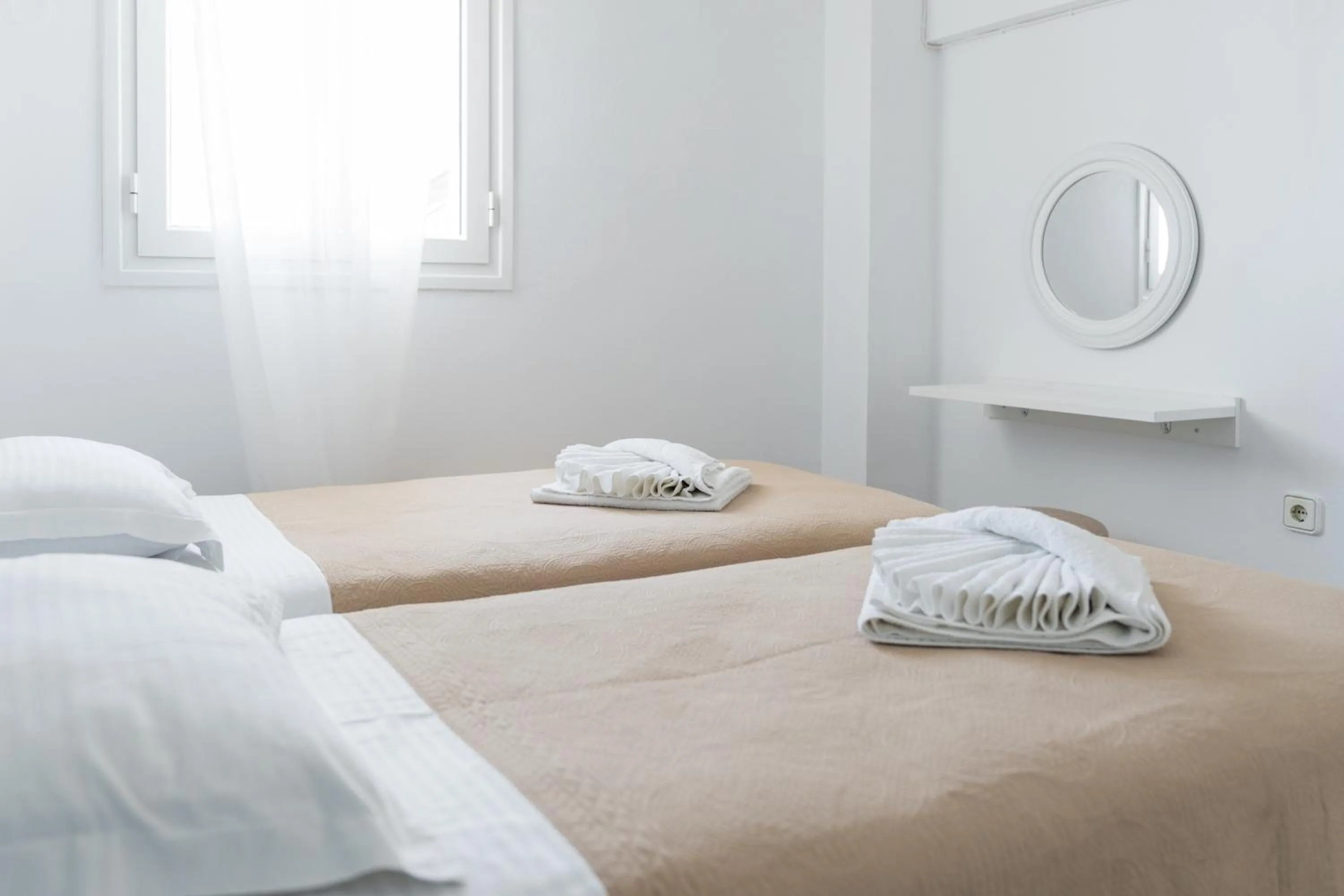 Bed in Poseidon Apartments