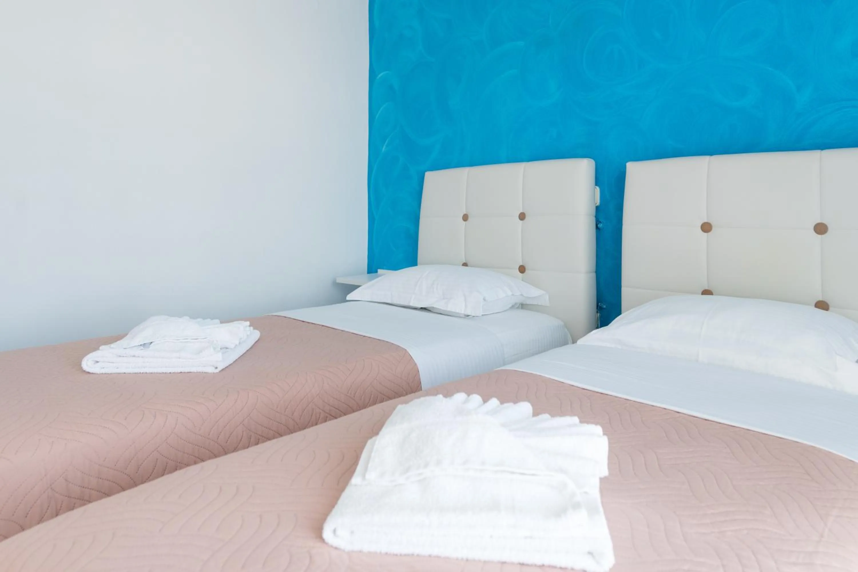 Bed in Poseidon Apartments