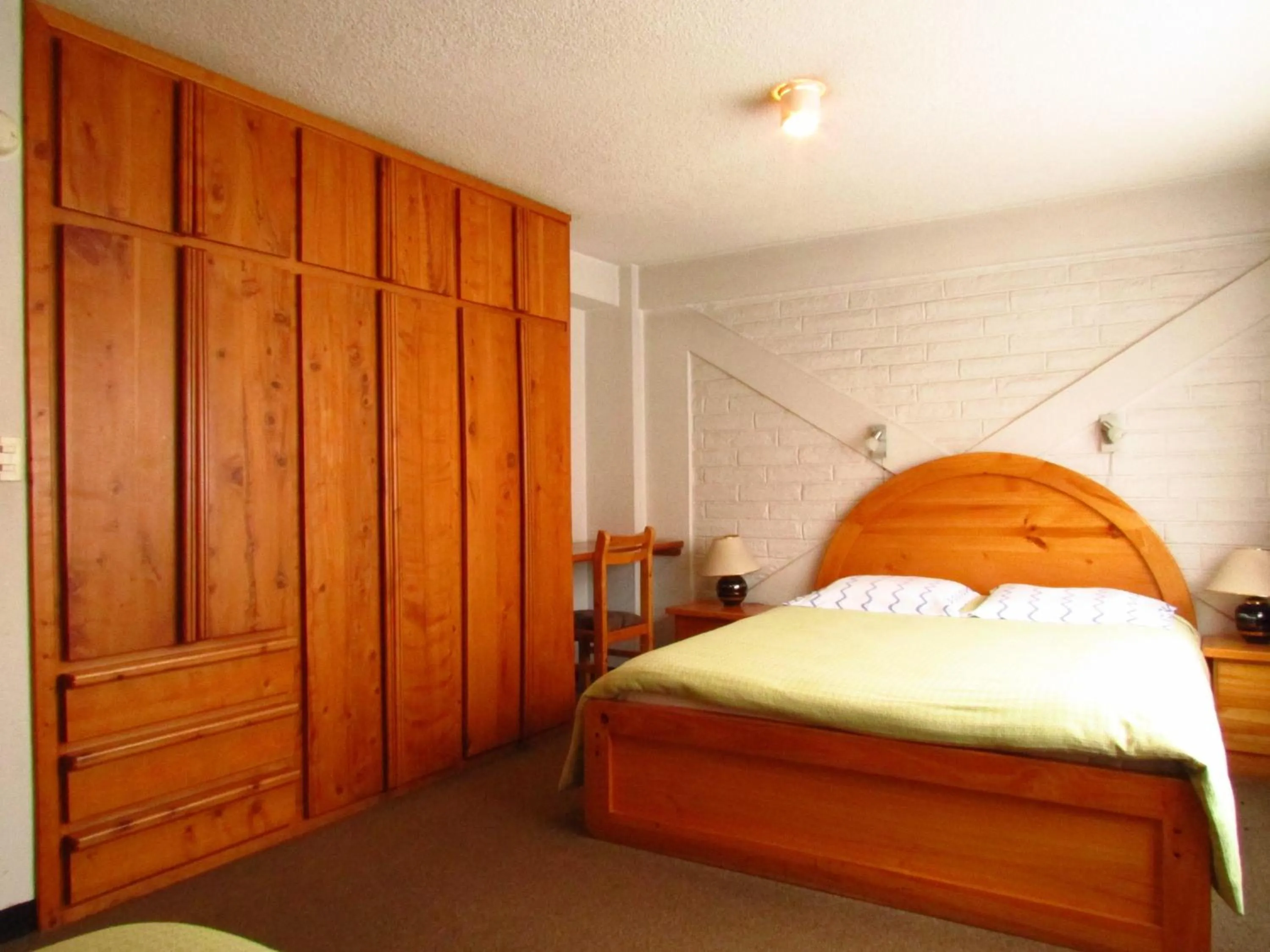 Bed in Apartamentos Los Quipus