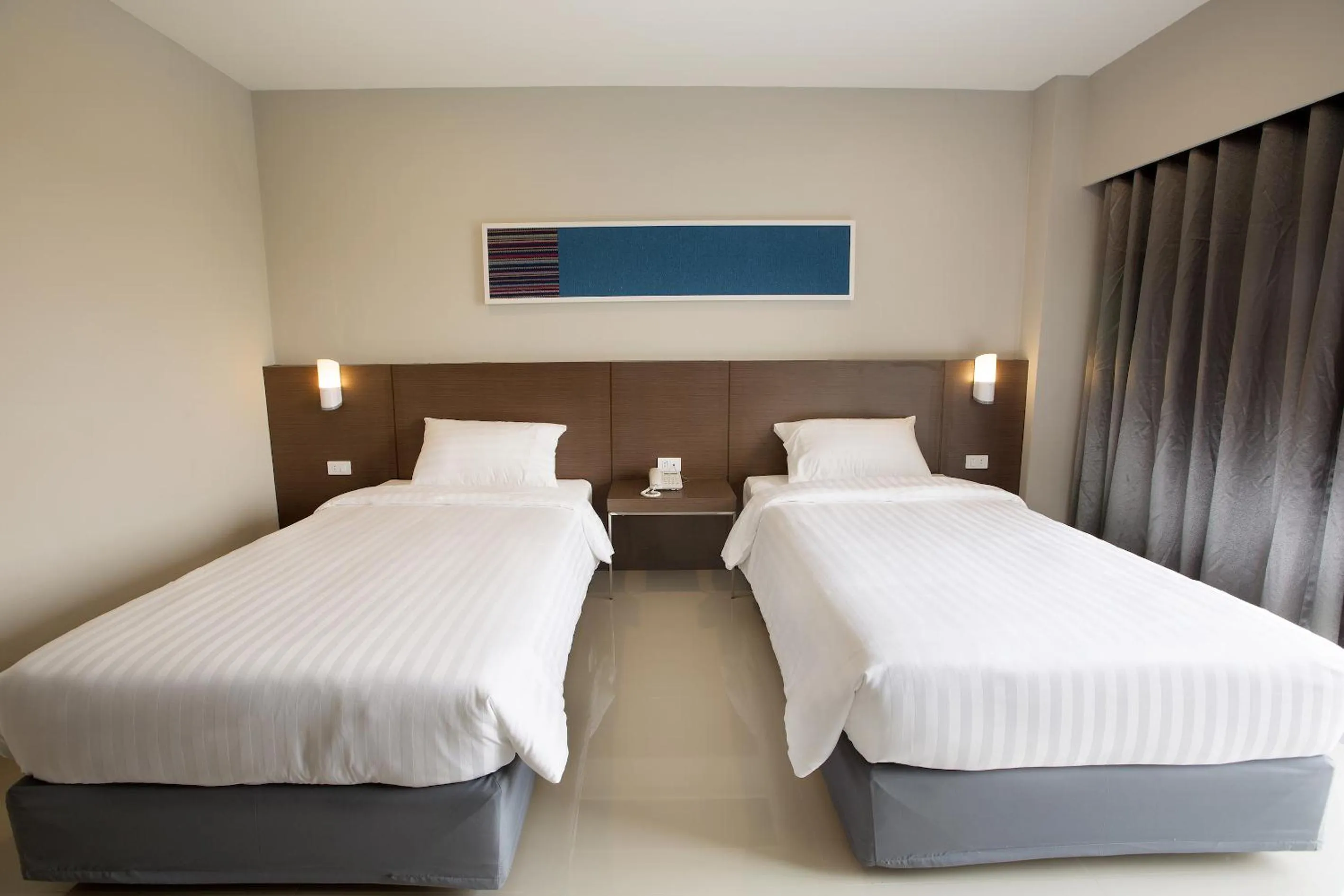 Photo of the whole room, Bed in V Hotel Ubon Ratchathani