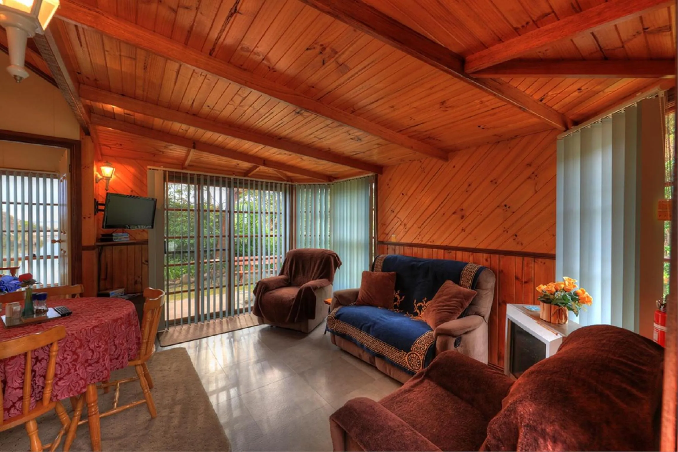 Living room in Stanley Lakeside Spa Cabins