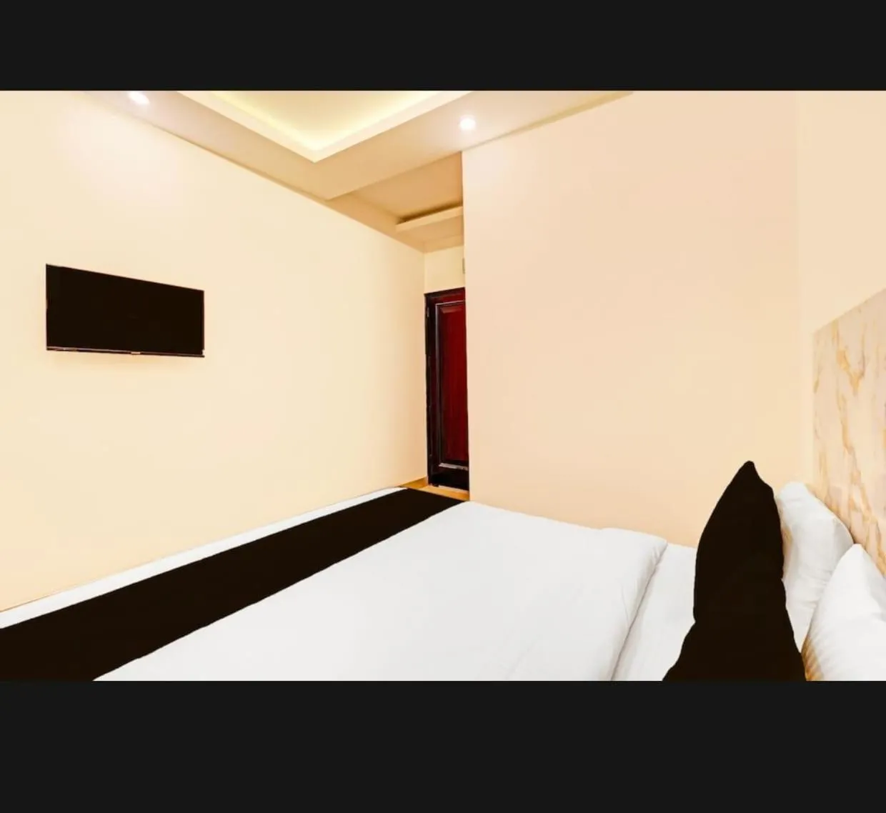 Bed in THE KRISHNA's BLISS HOTEL