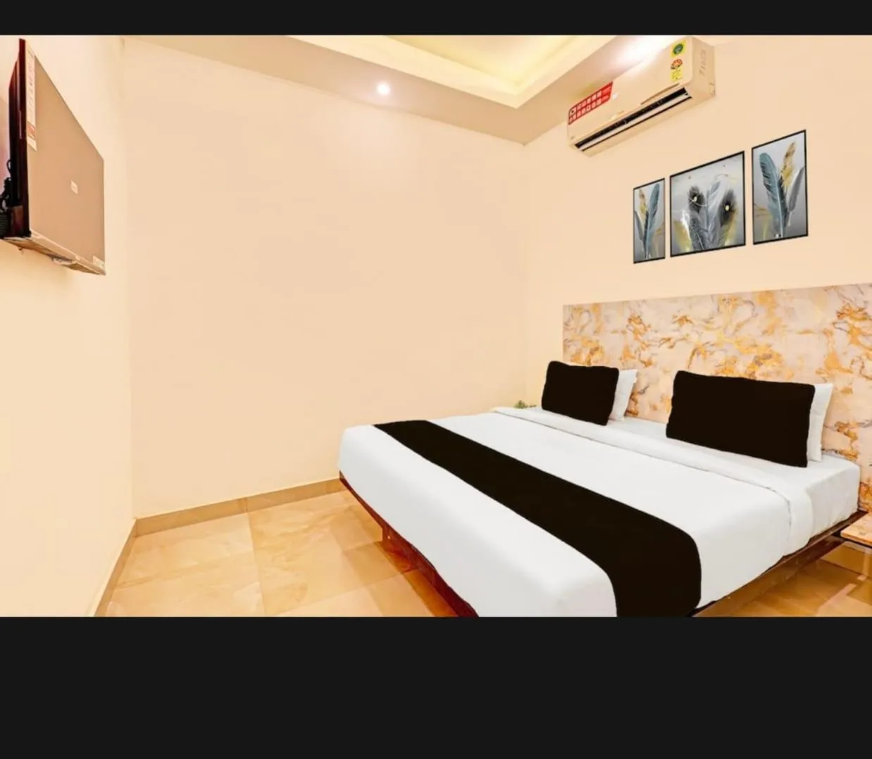 Bed in THE KRISHNA's BLISS HOTEL