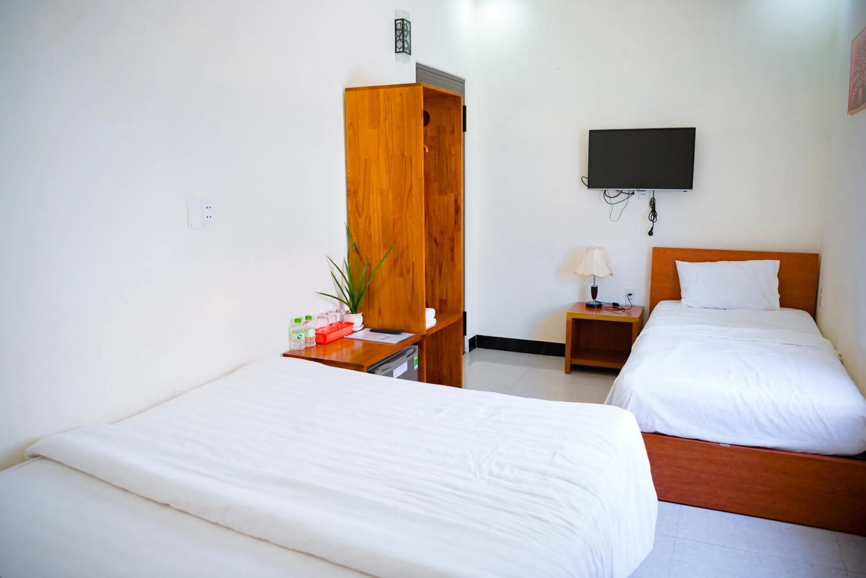 Communal lounge/ TV room, Bed in Gold Stone Hoi An Homestay