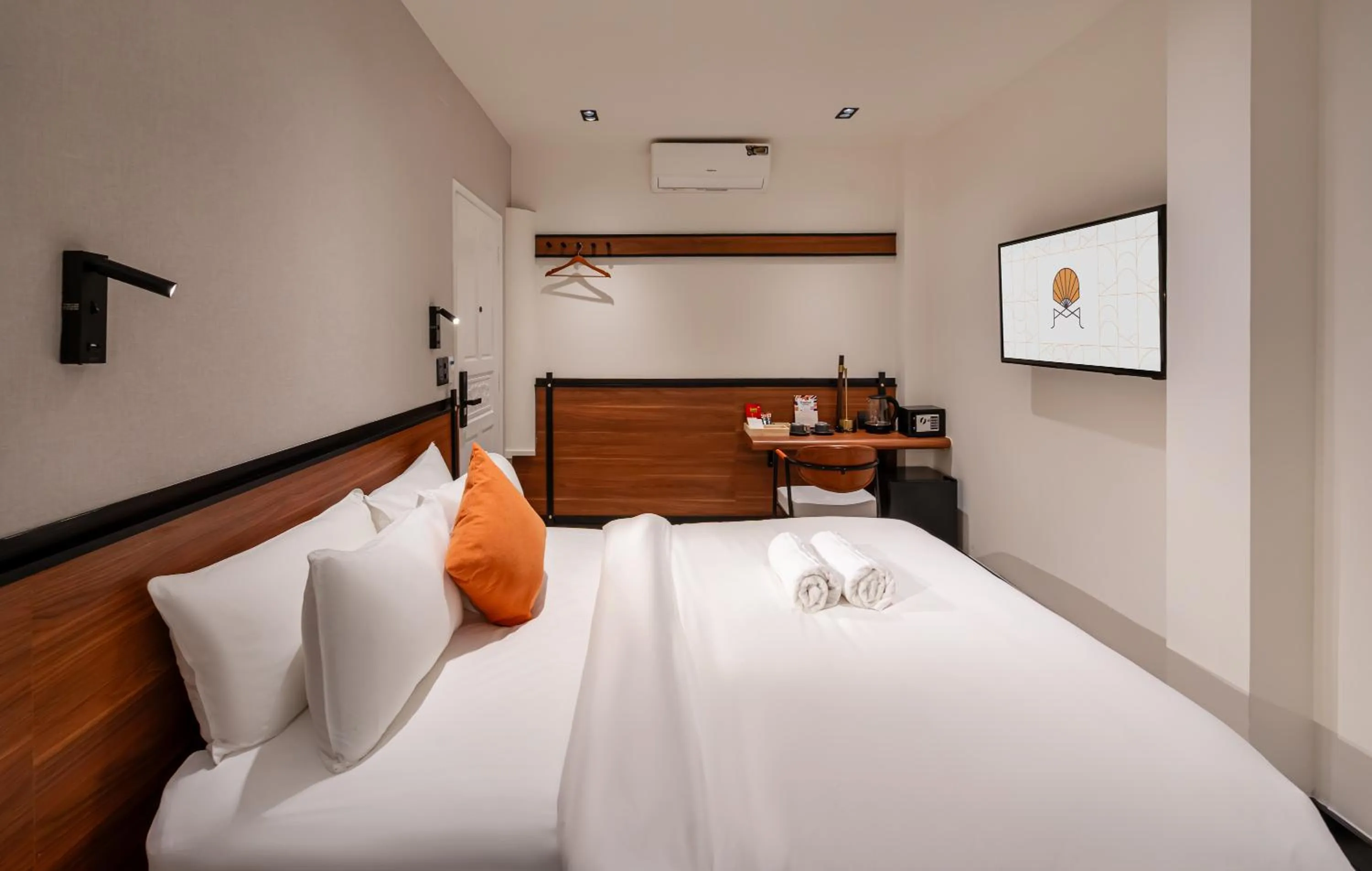 Bed in Metrolux City Contemporary Hotel