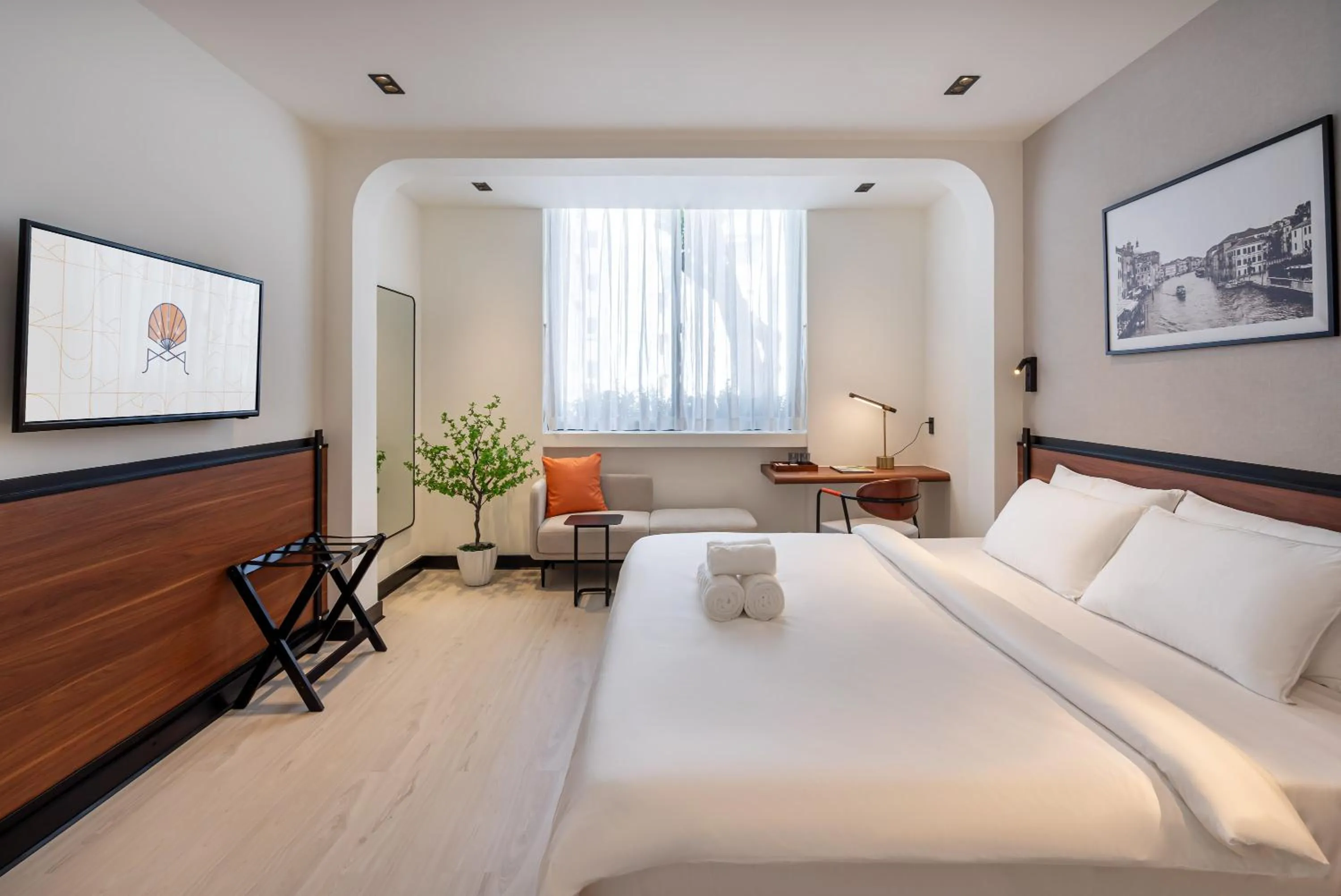 Bed in Metrolux City Contemporary Hotel