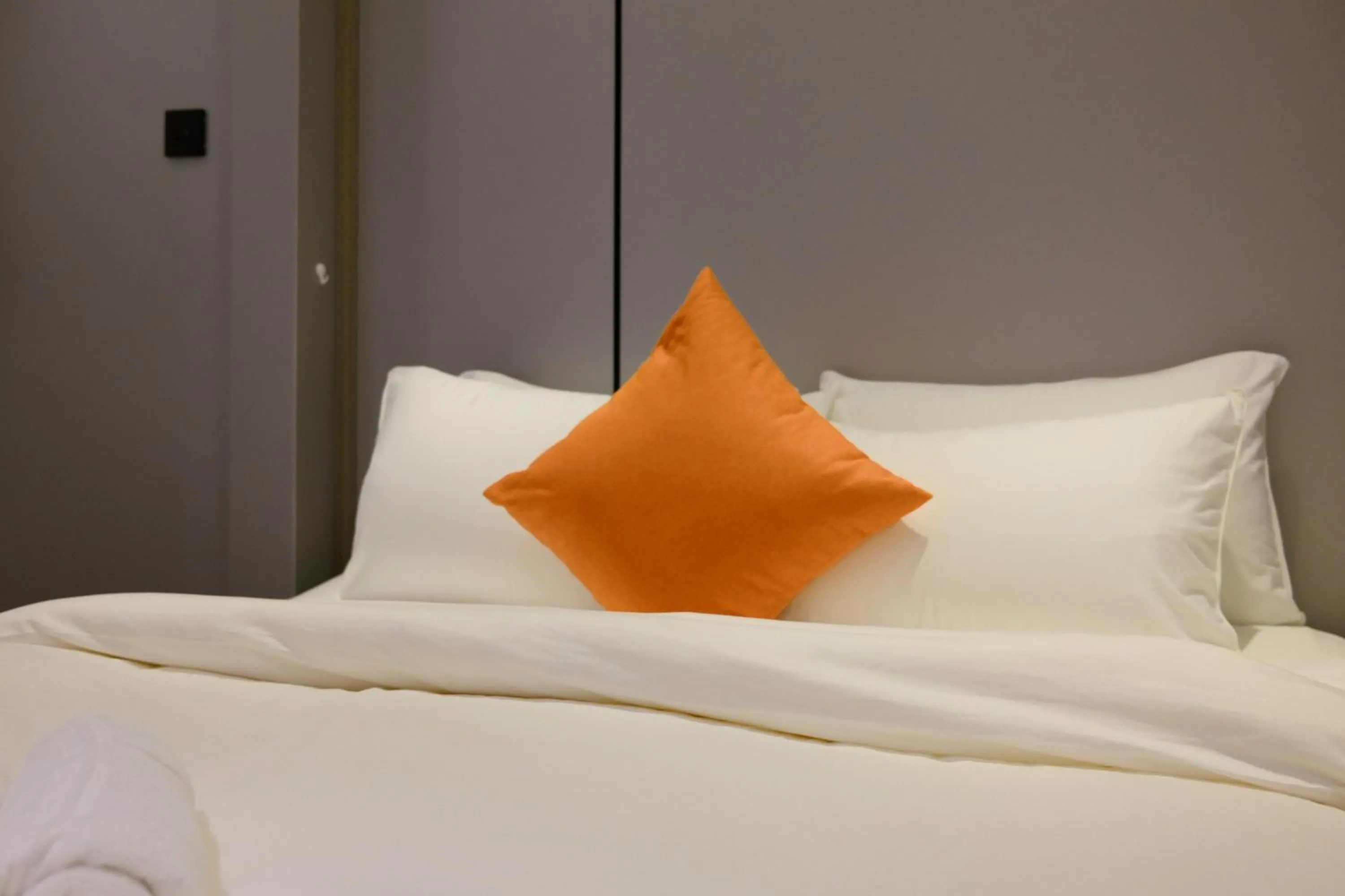 Bed in Metrolux City Contemporary Hotel