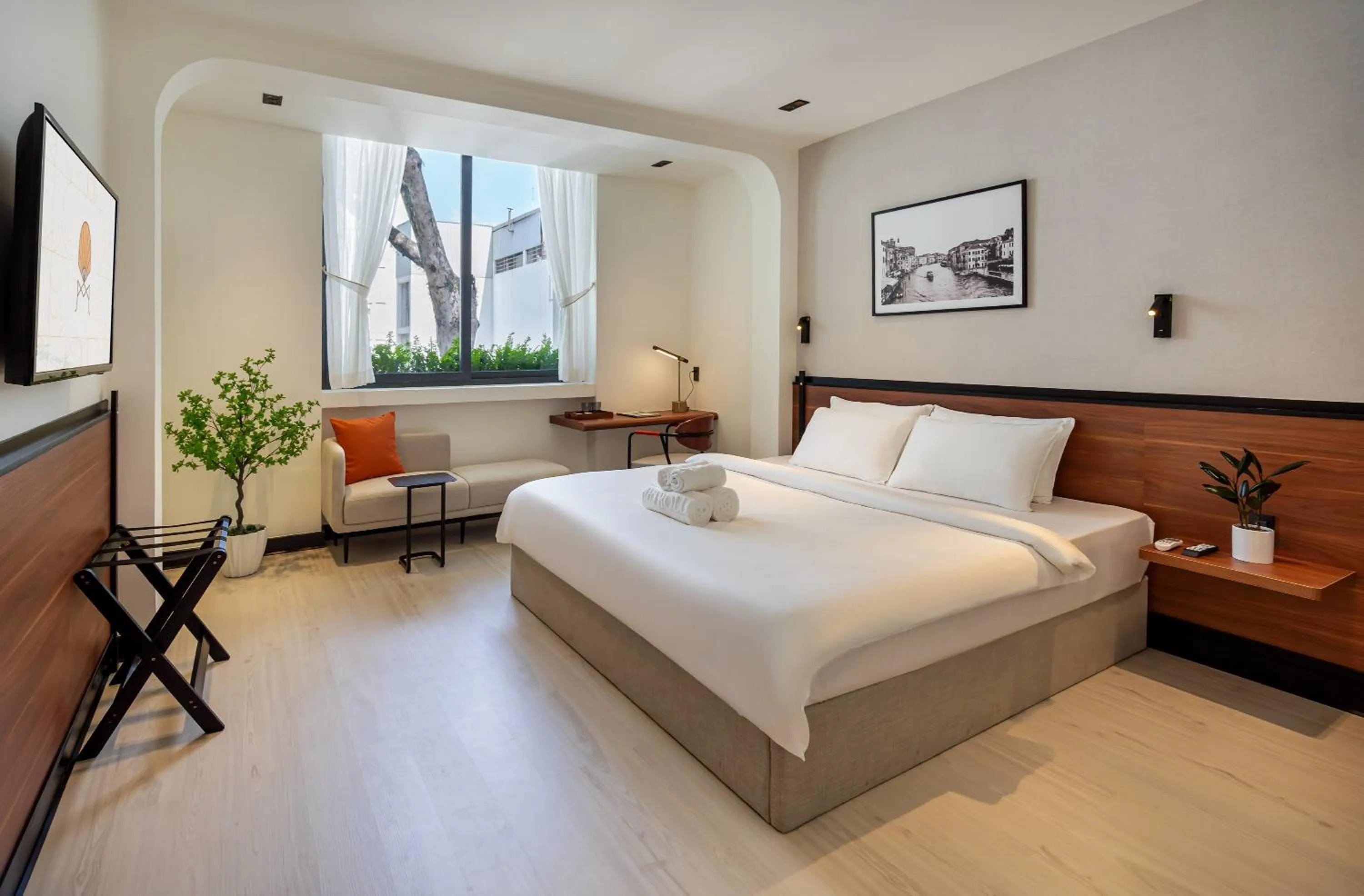 Bed in Metrolux City Contemporary Hotel