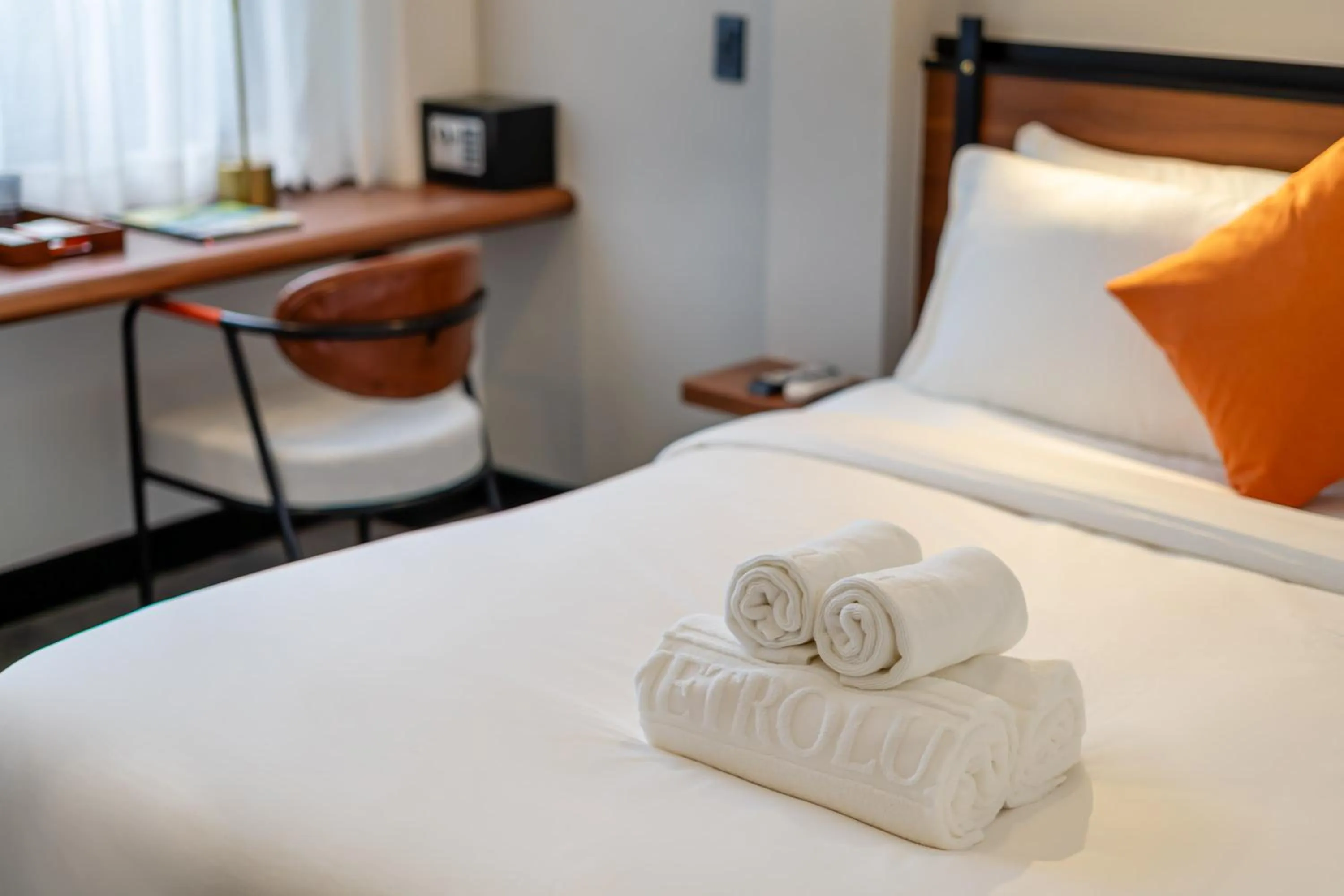 Bed in Metrolux City Contemporary Hotel