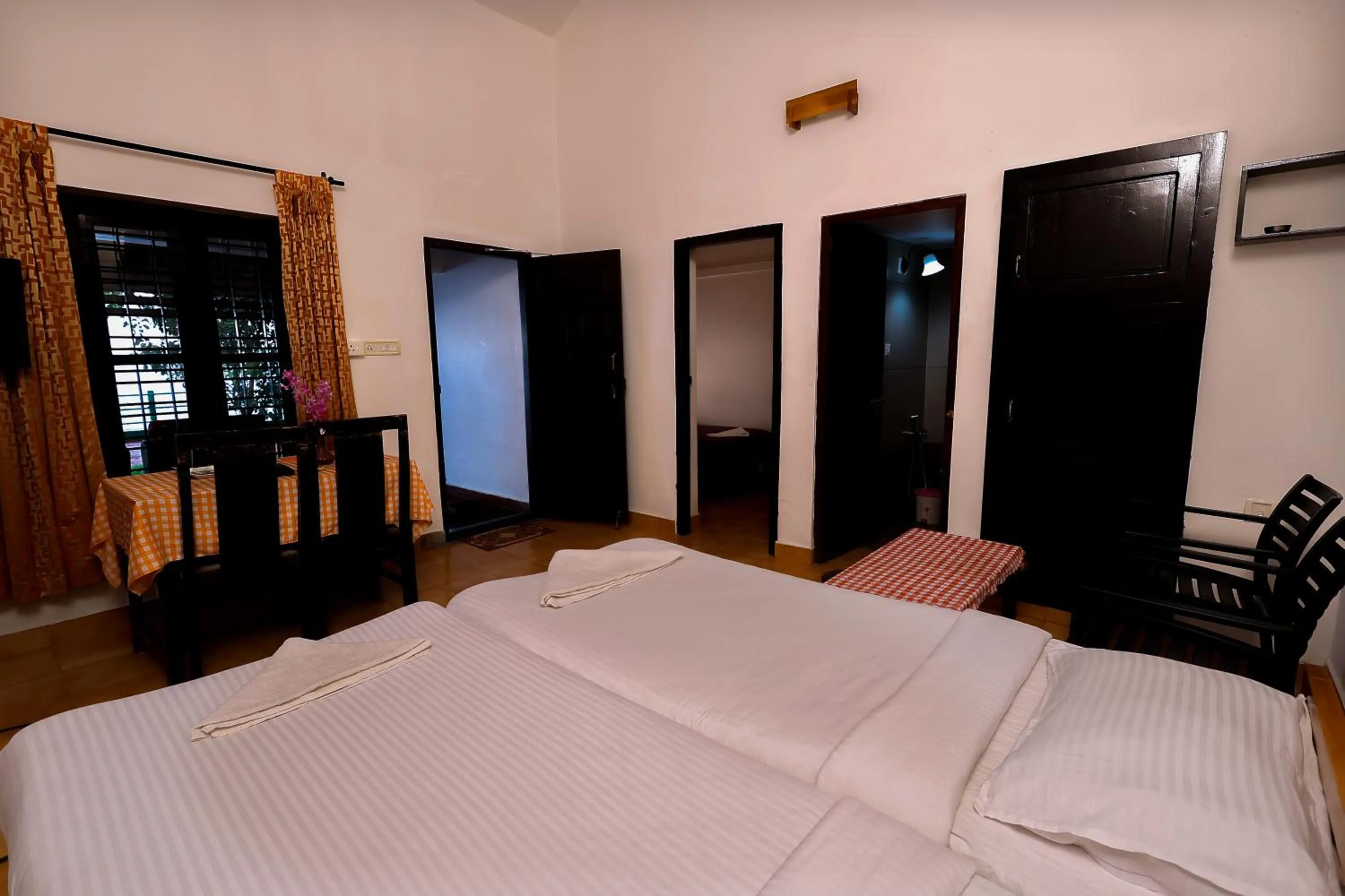 Bed in ILLIKKALAM Lakeside Cottages Kumarakom Kerala