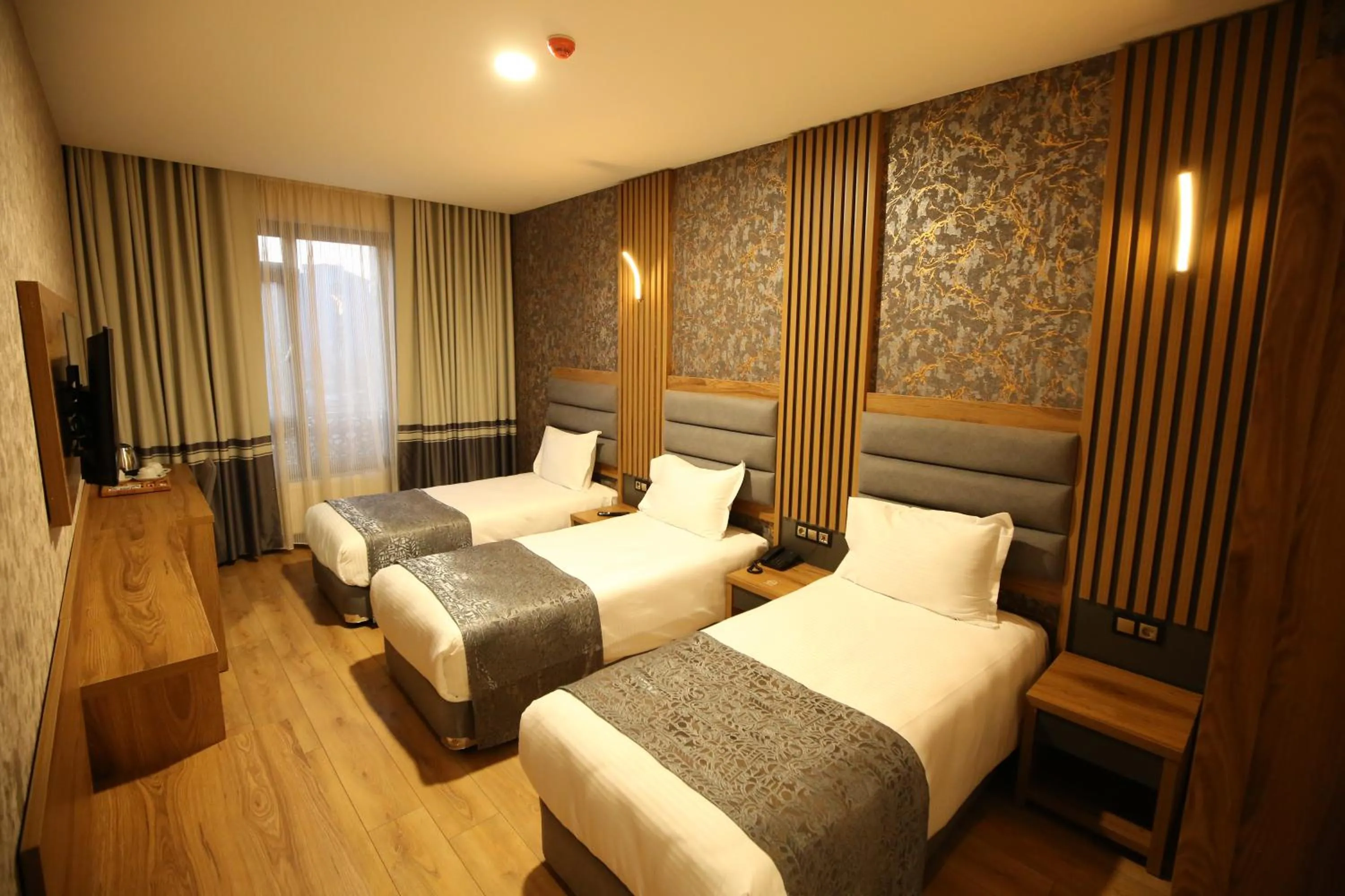 Bed in Büpa Plus Hotel