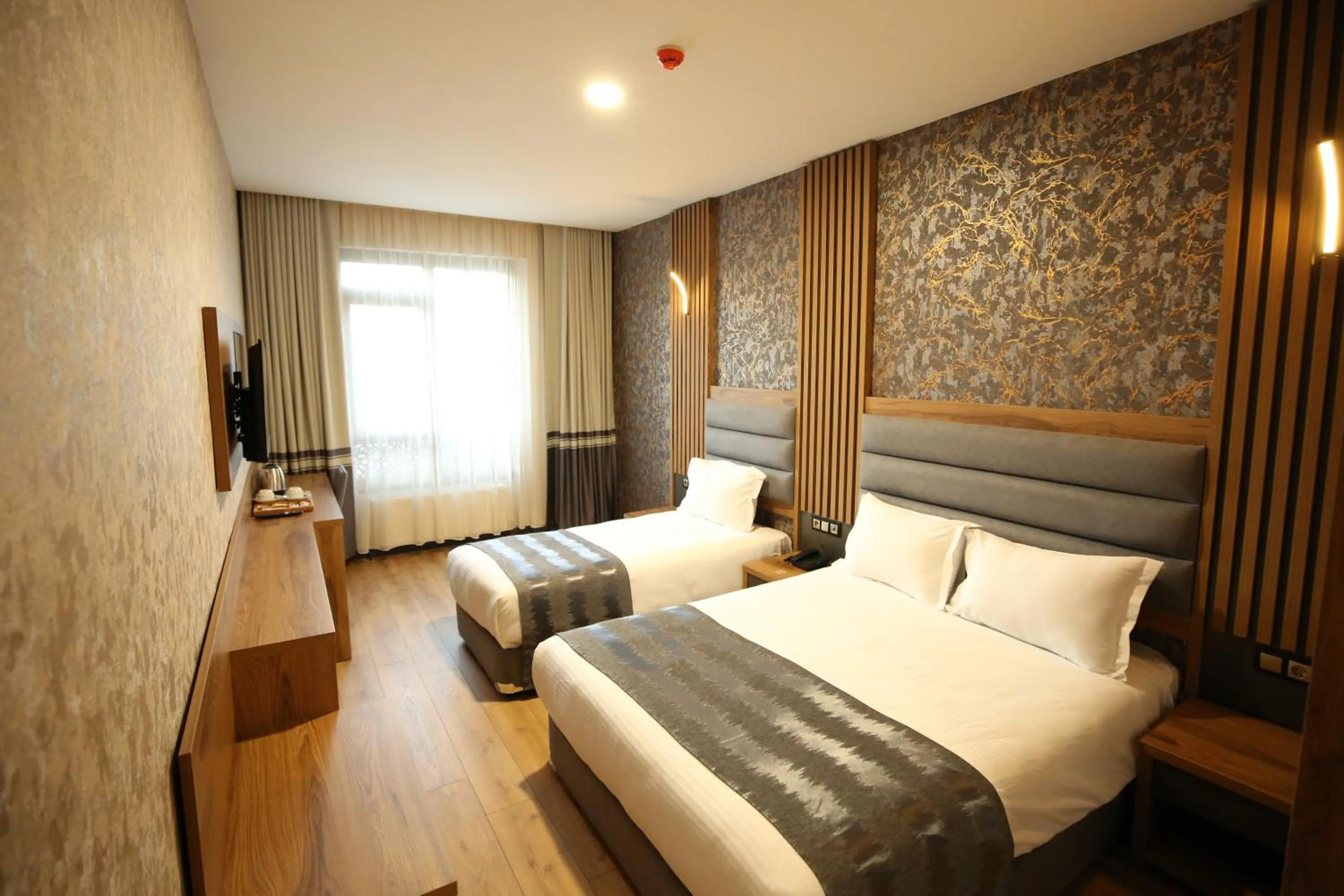 Bed in Büpa Plus Hotel