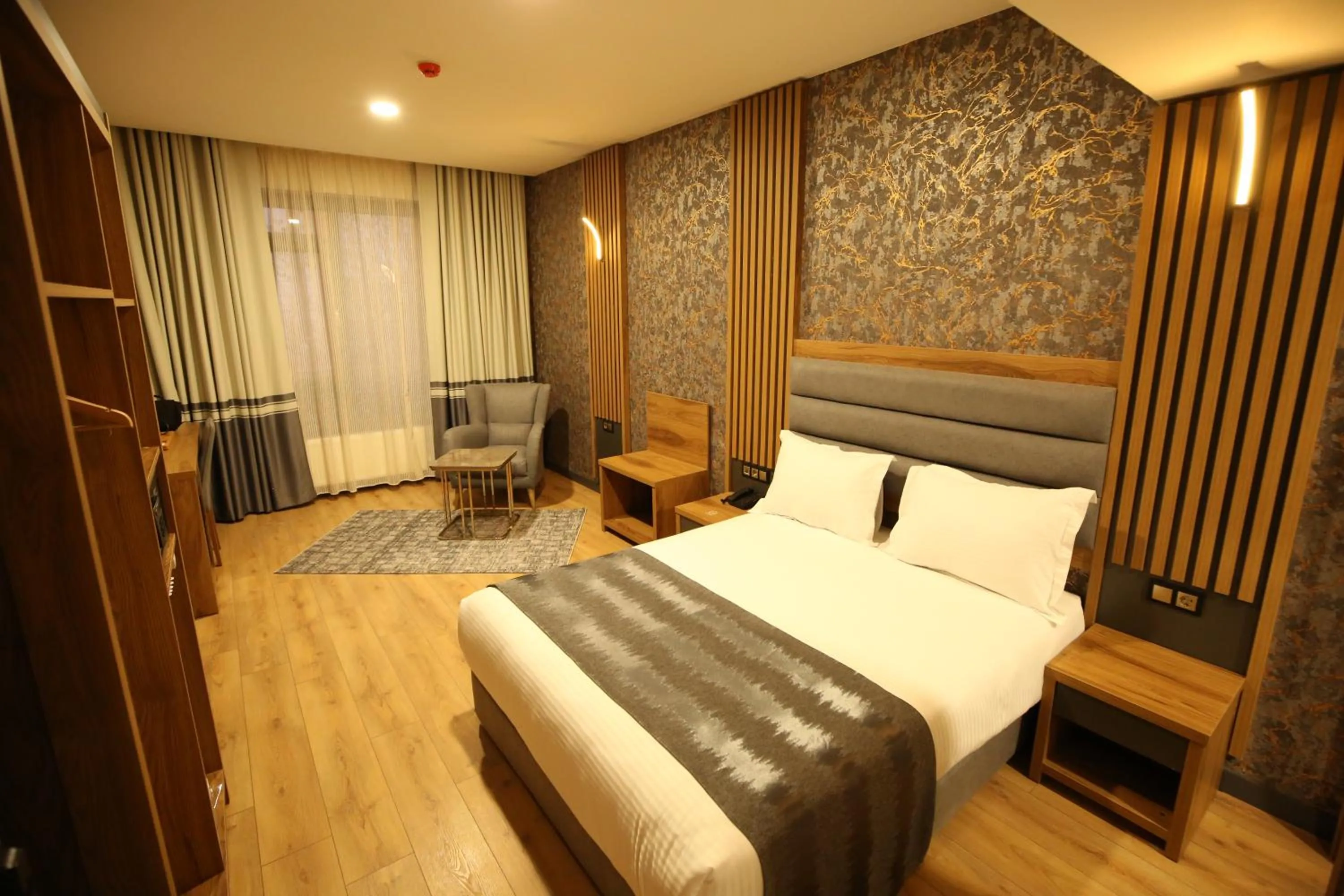 Bed in Büpa Plus Hotel