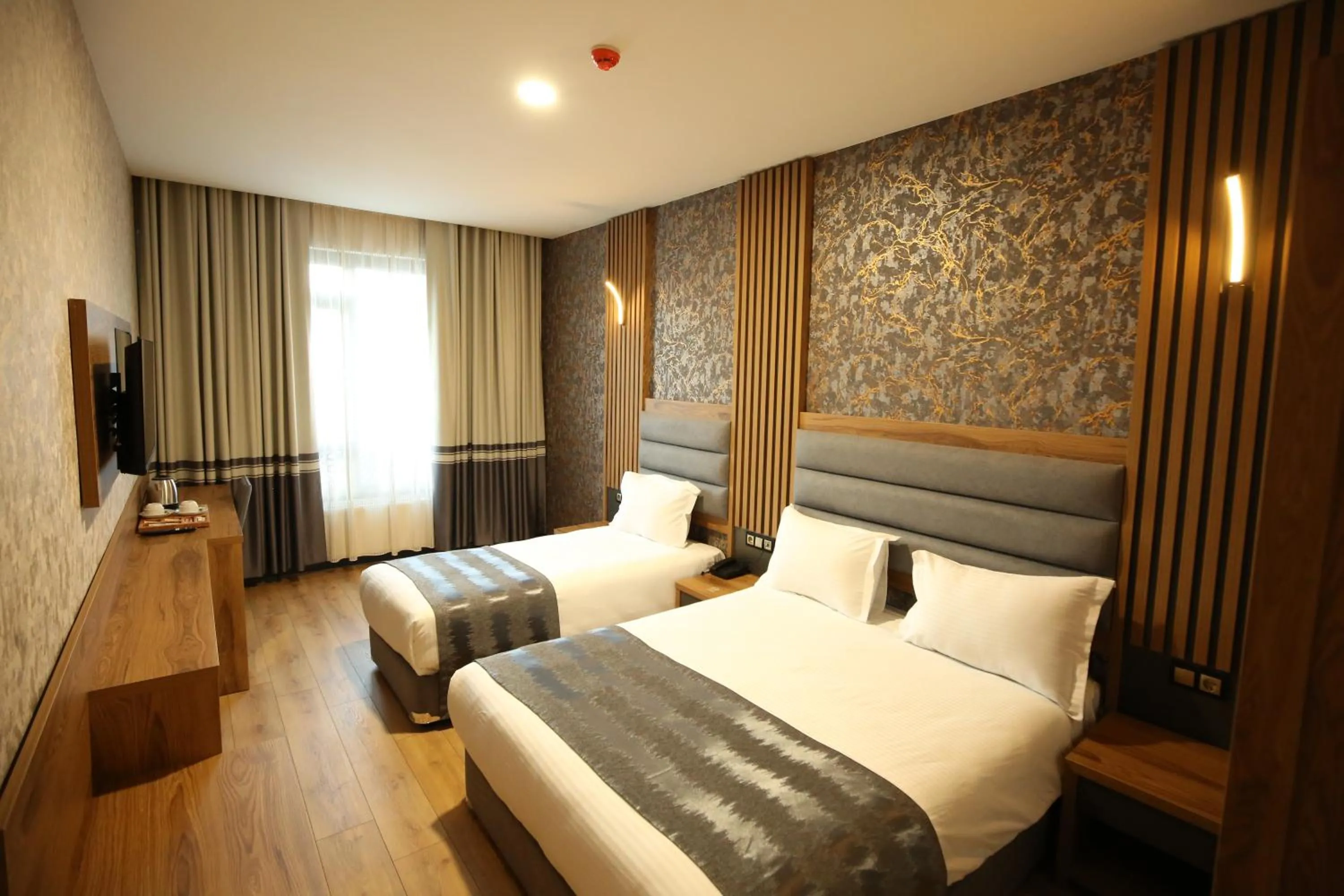 Bed in Büpa Plus Hotel