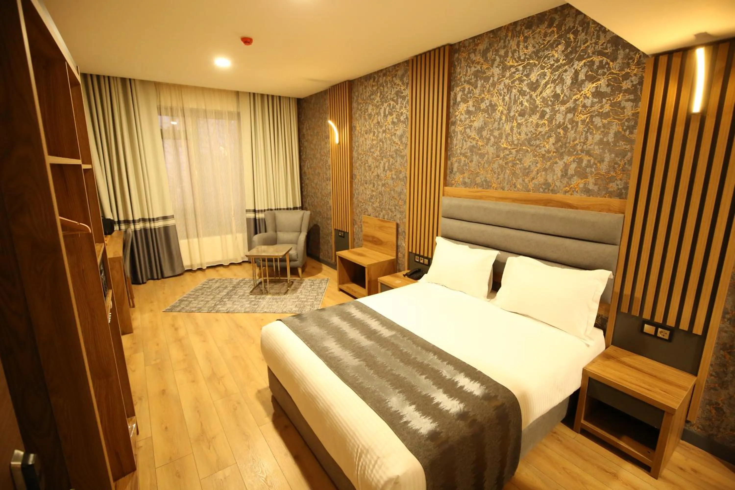 Bed in Büpa Plus Hotel
