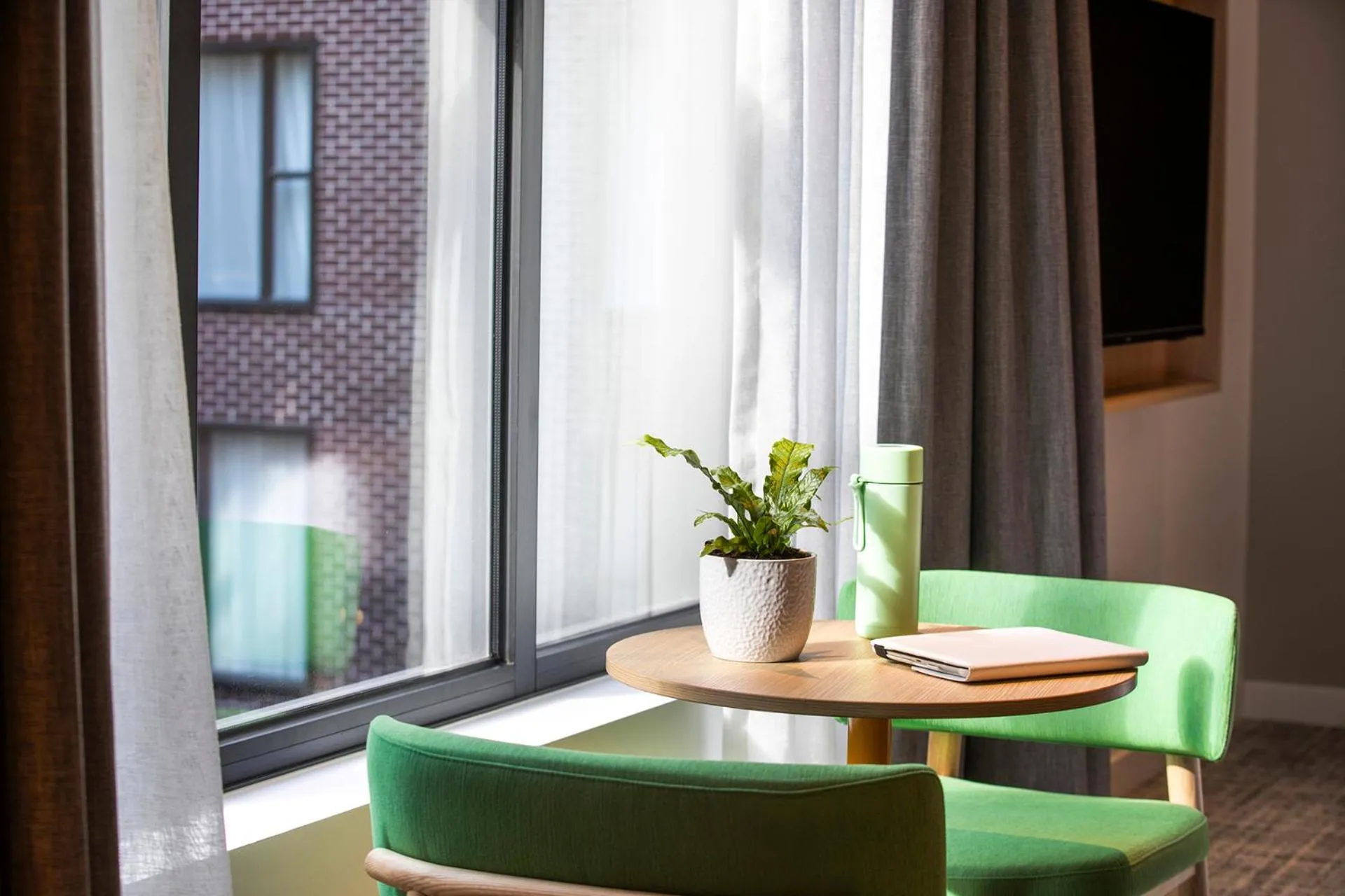 Seating area in Holiday Inn Melbourne Bourke Street Mall by IHG