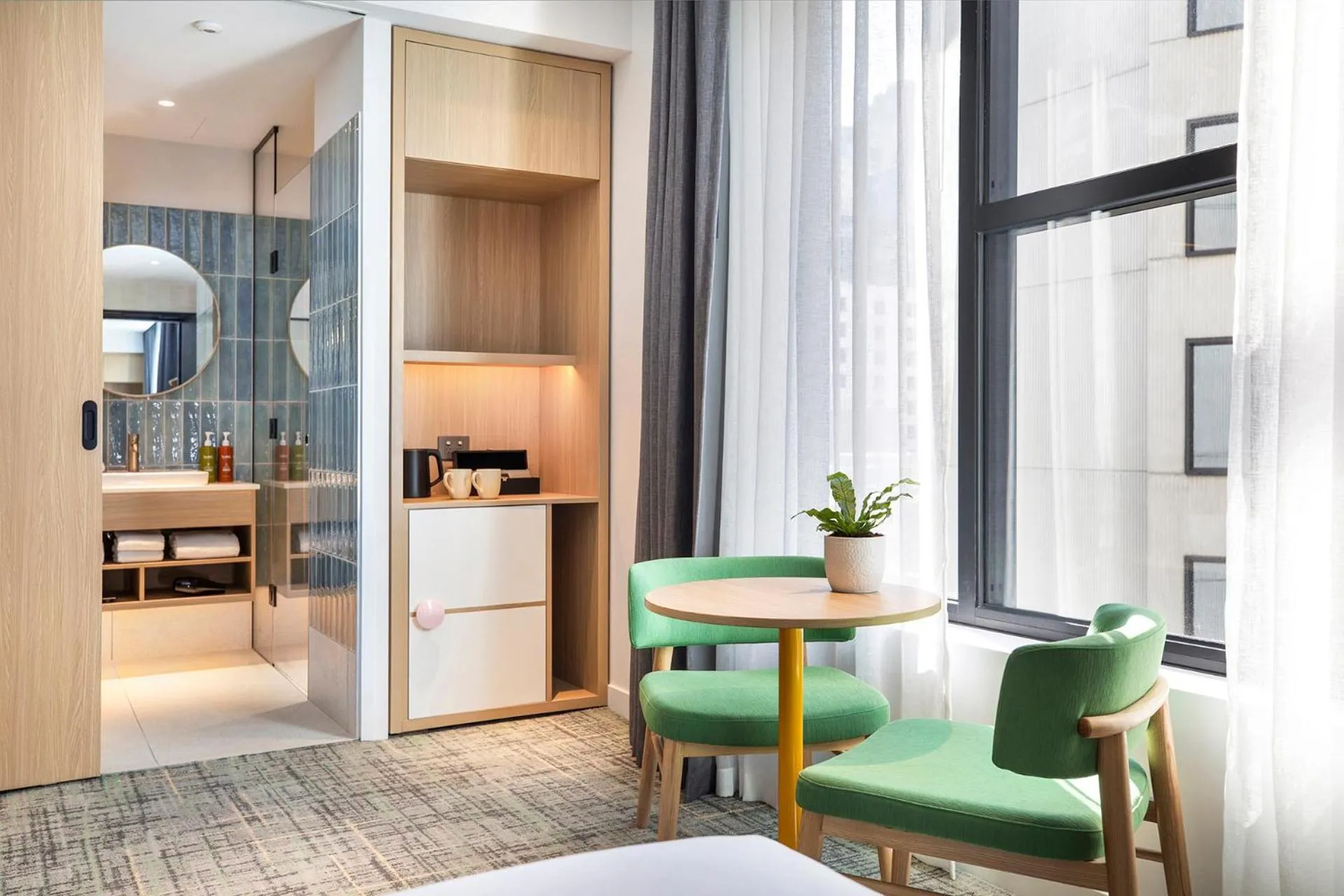 Seating area in Holiday Inn Melbourne Bourke Street Mall by IHG