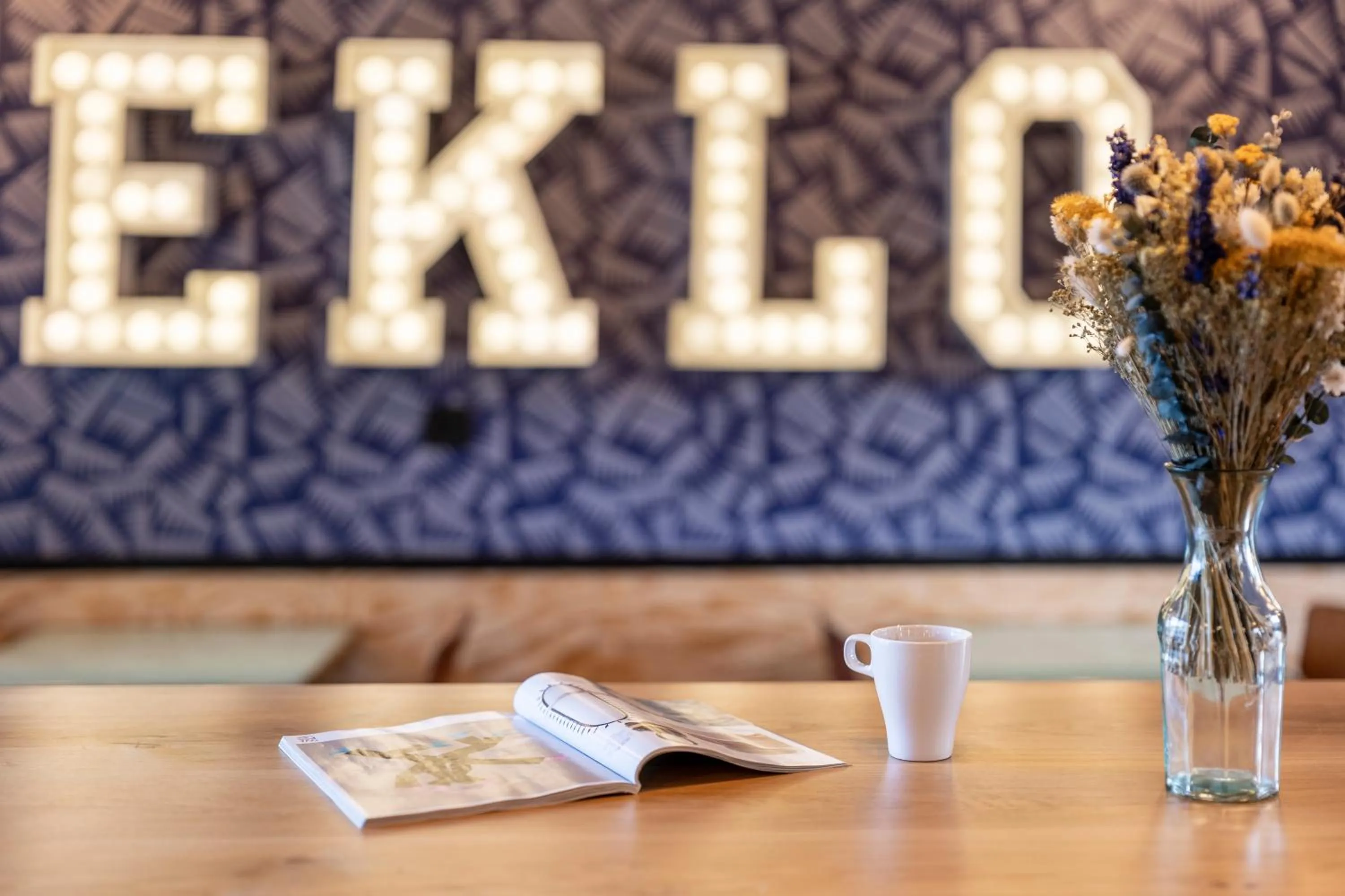 Communal lounge/ TV room in Eklo Hotels Le Havre