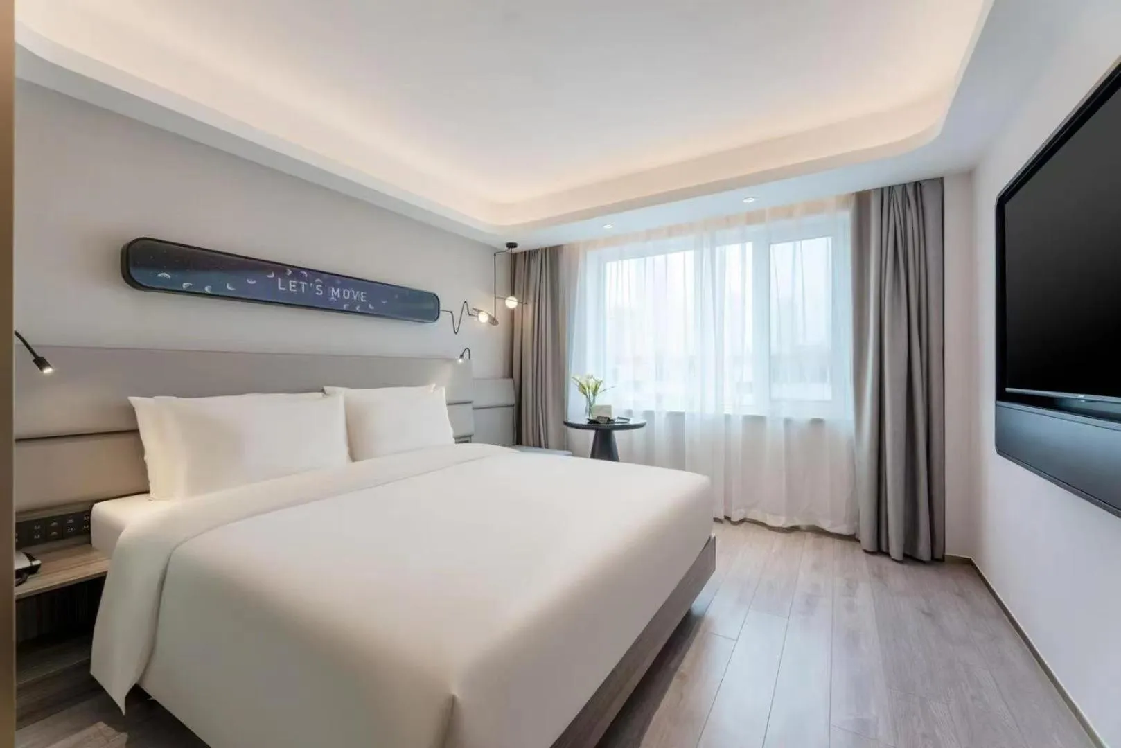 Bed in Atour Light Hotel Dalian Xinghai Square Hang Lung Shopping Center