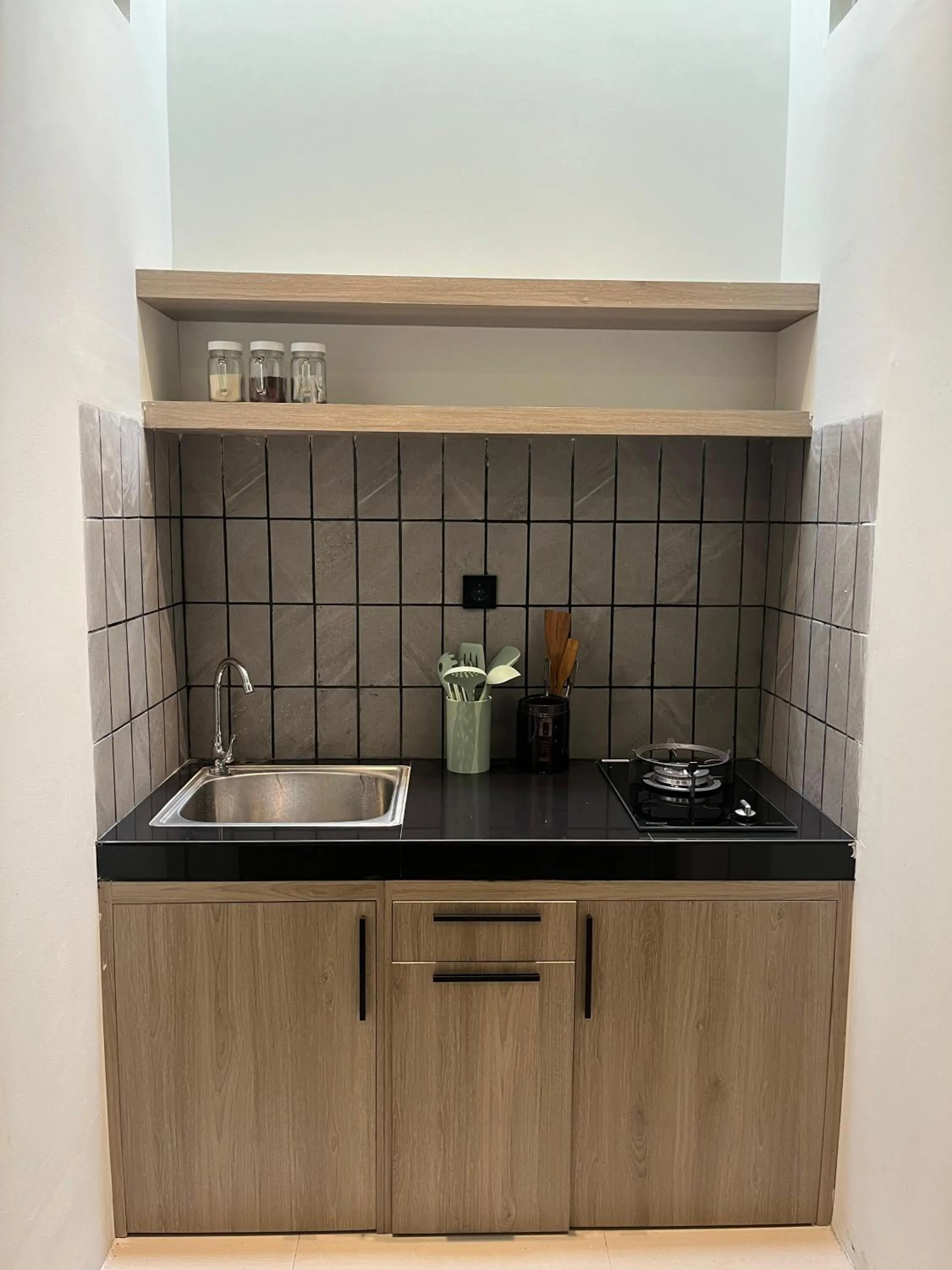 Kitchen or kitchenette in Sampai Town Hotel