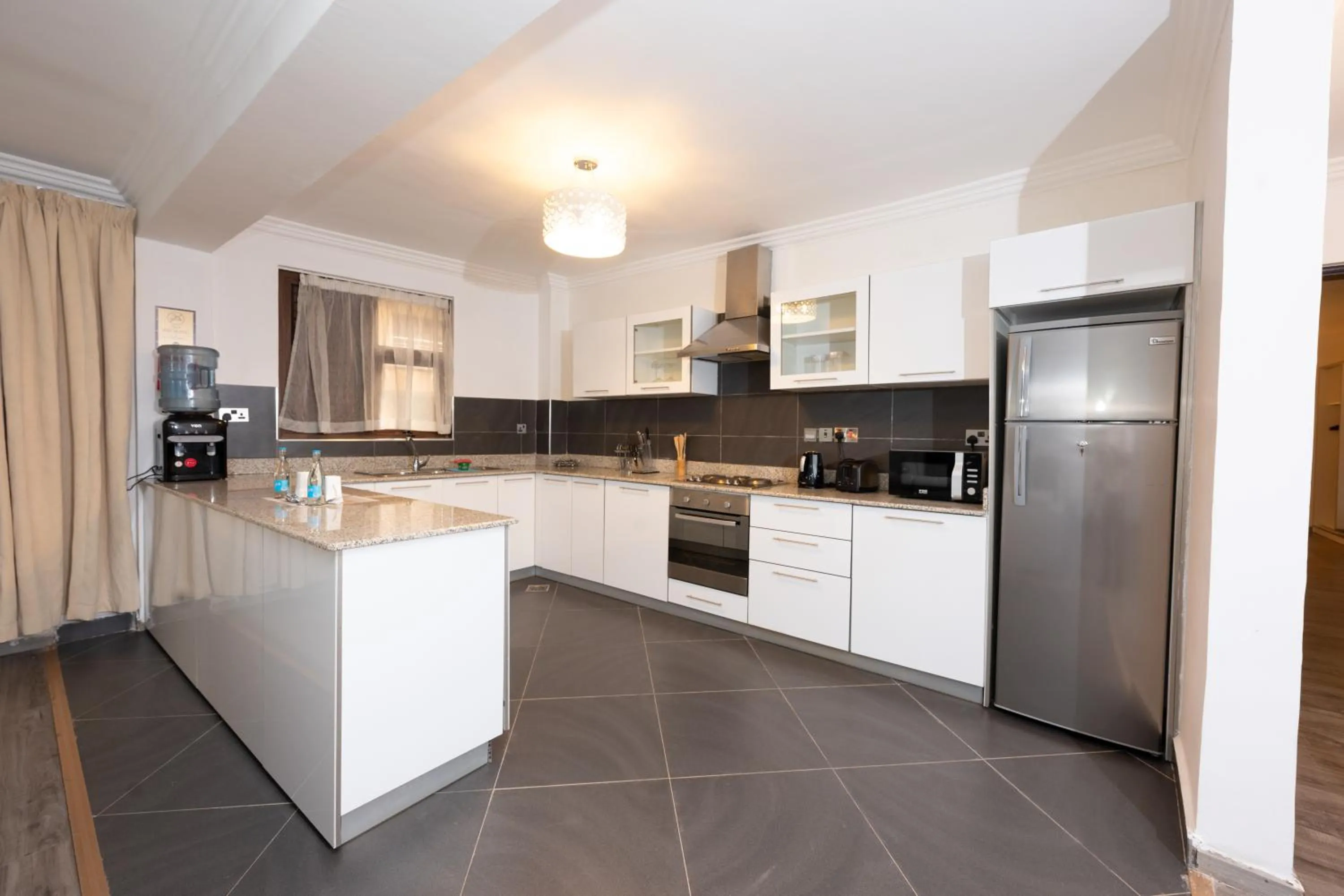 kitchen in Lavington Residences By Trianum