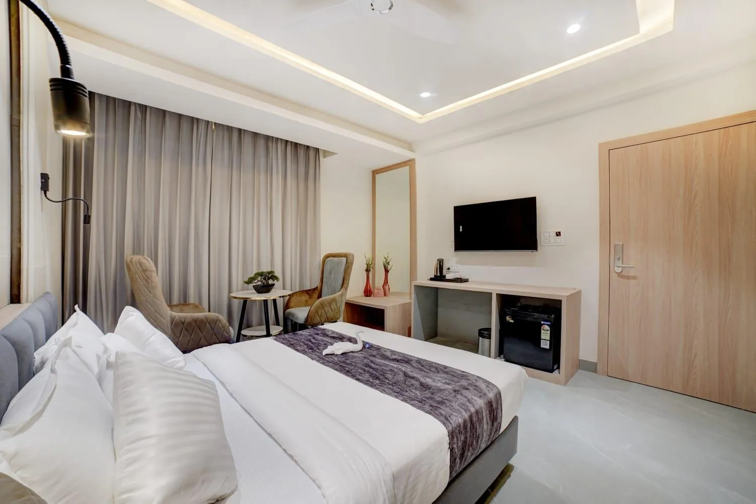 Bedroom in Madhuram Business Hotel