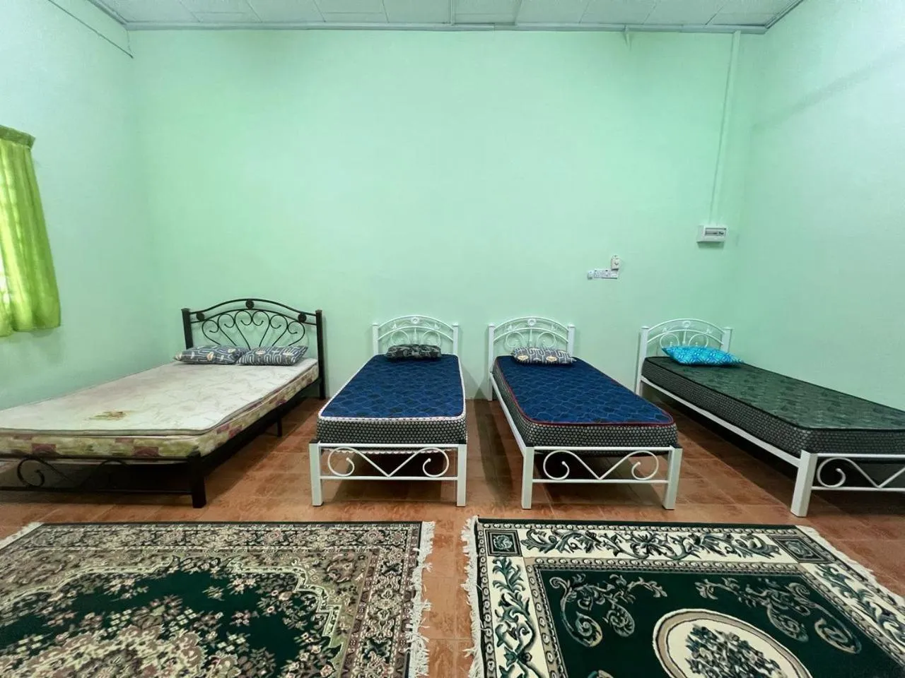 Bedroom in Capital O 91117 Noor Room Stay