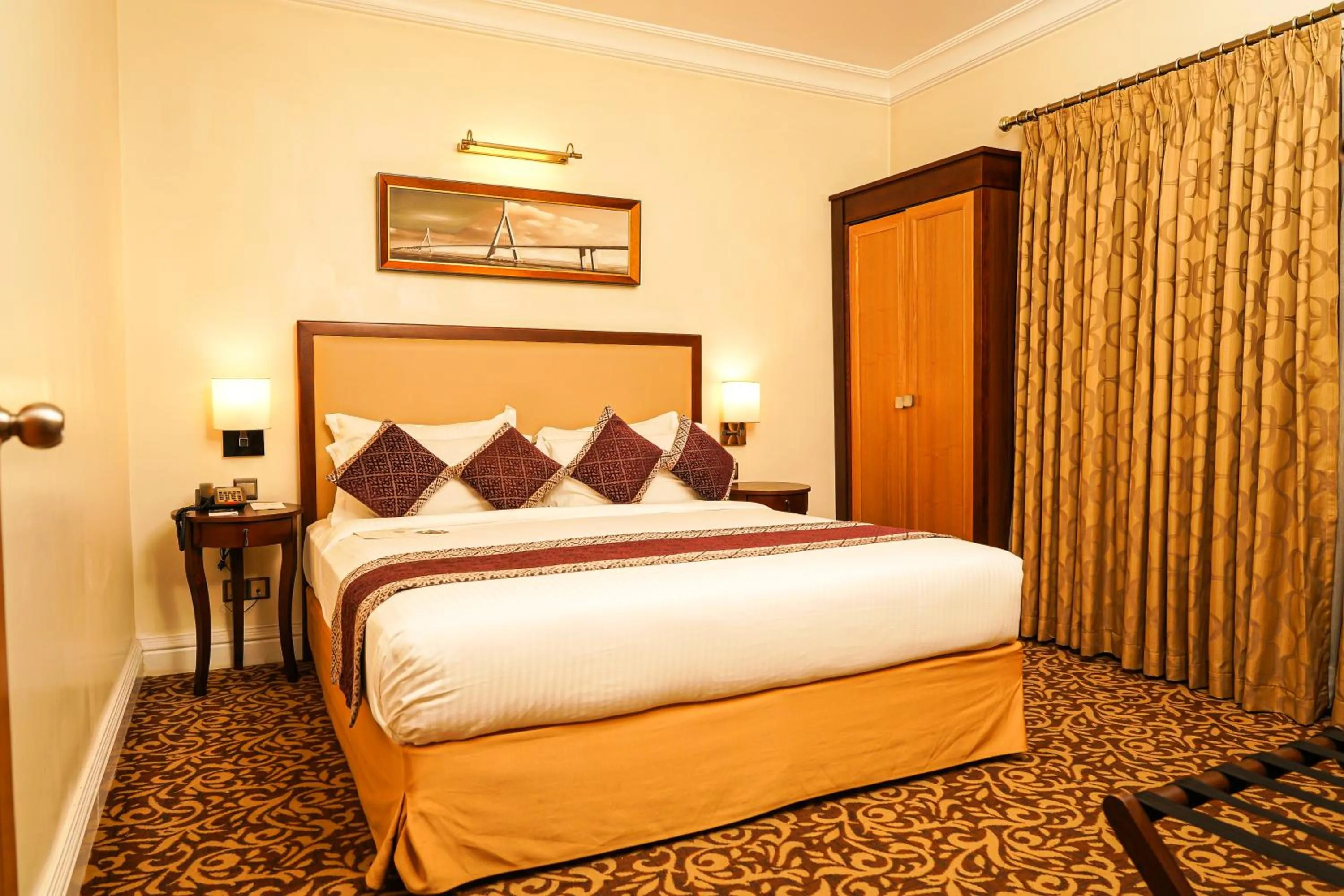 Bed in Royal Park Residence Hotel