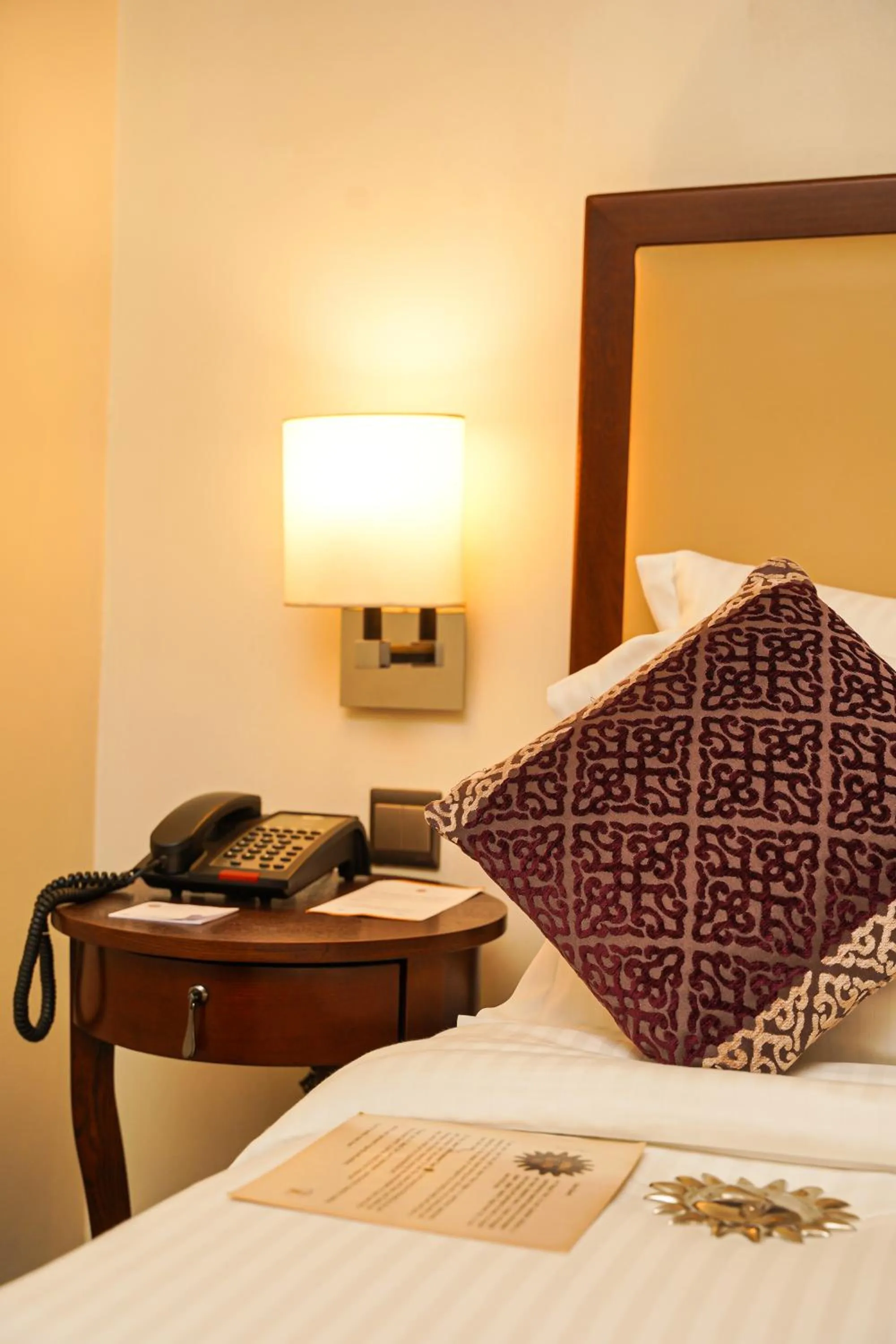 Bed in Royal Park Residence Hotel