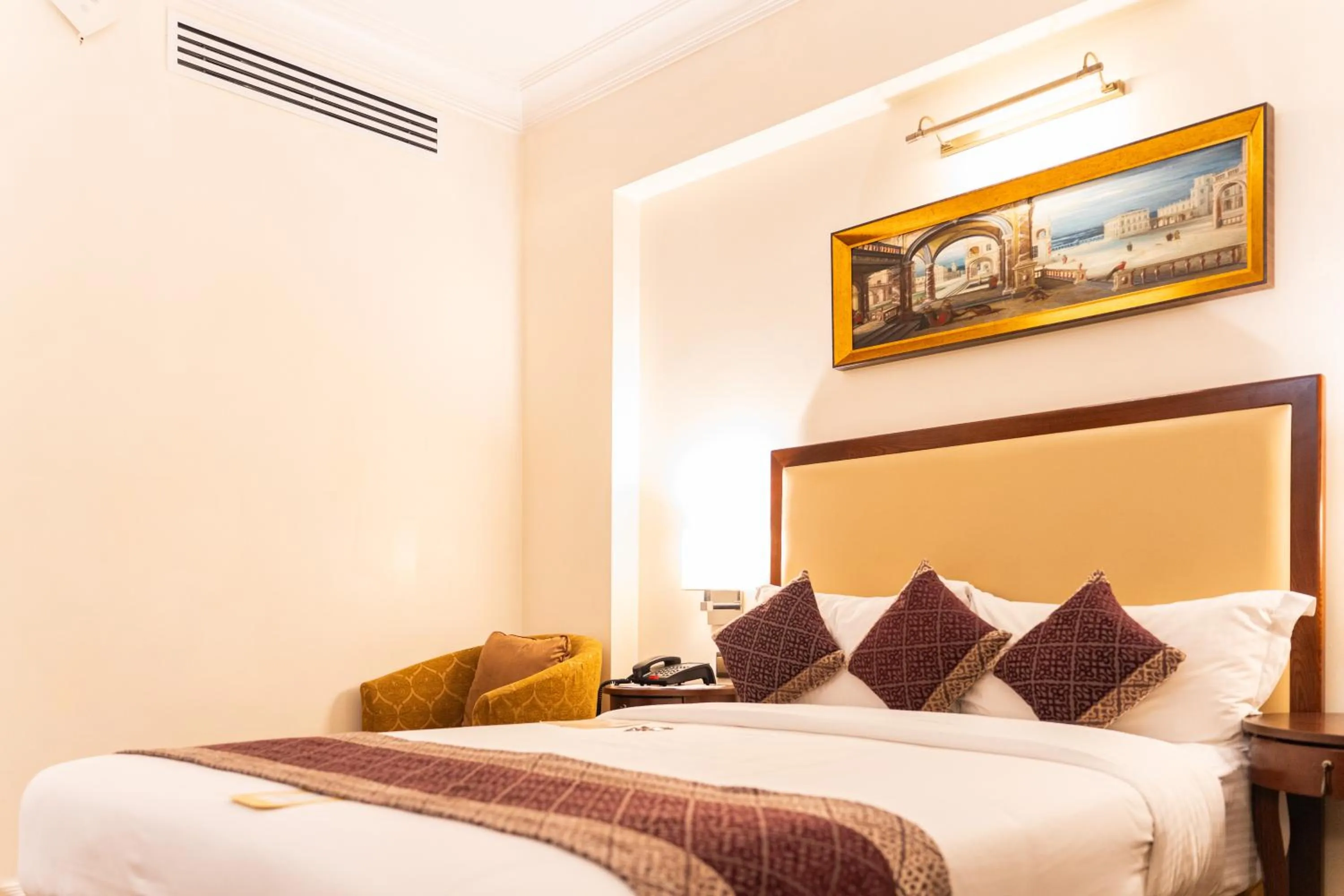 Bed in Royal Park Residence Hotel