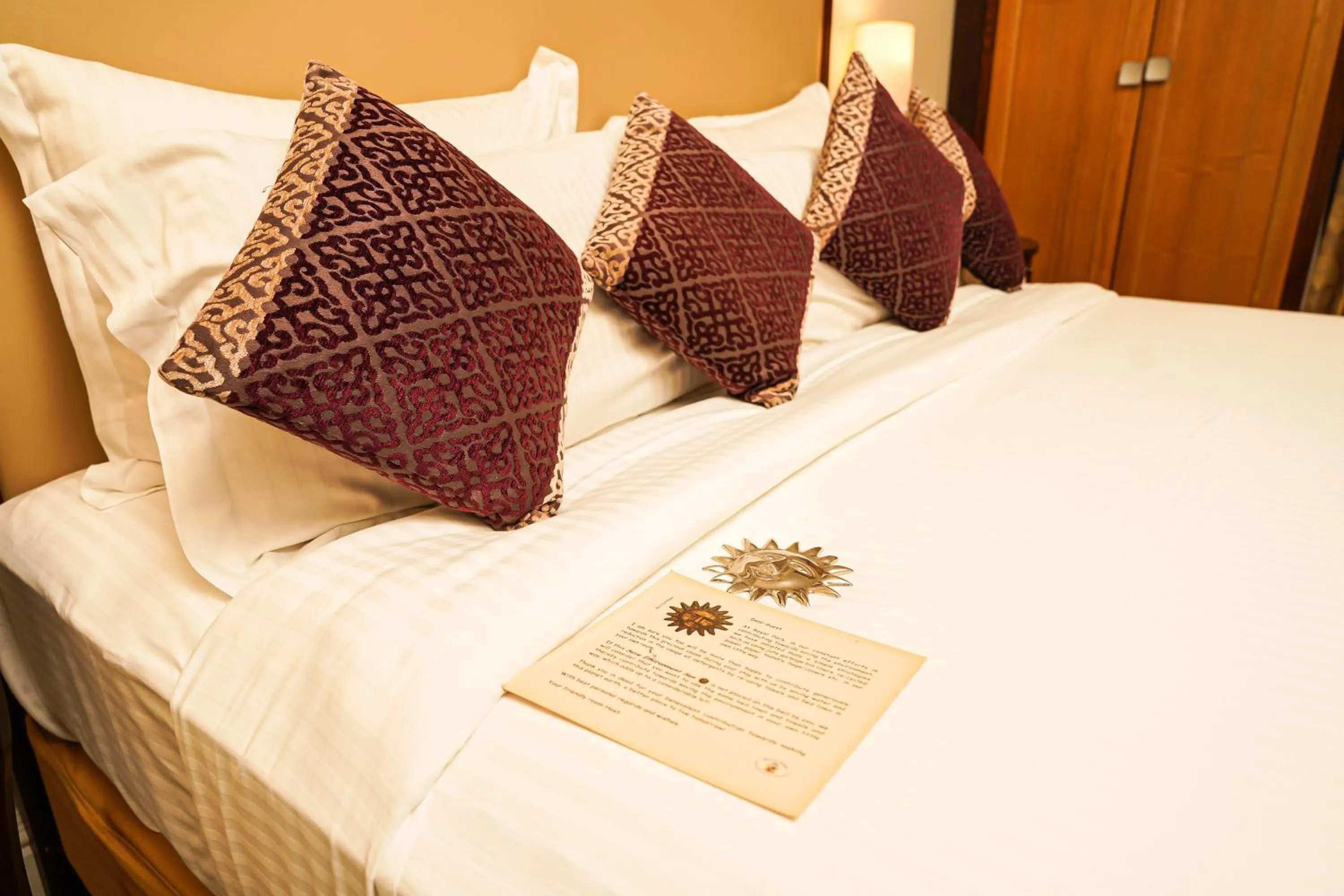 Bed in Royal Park Residence Hotel