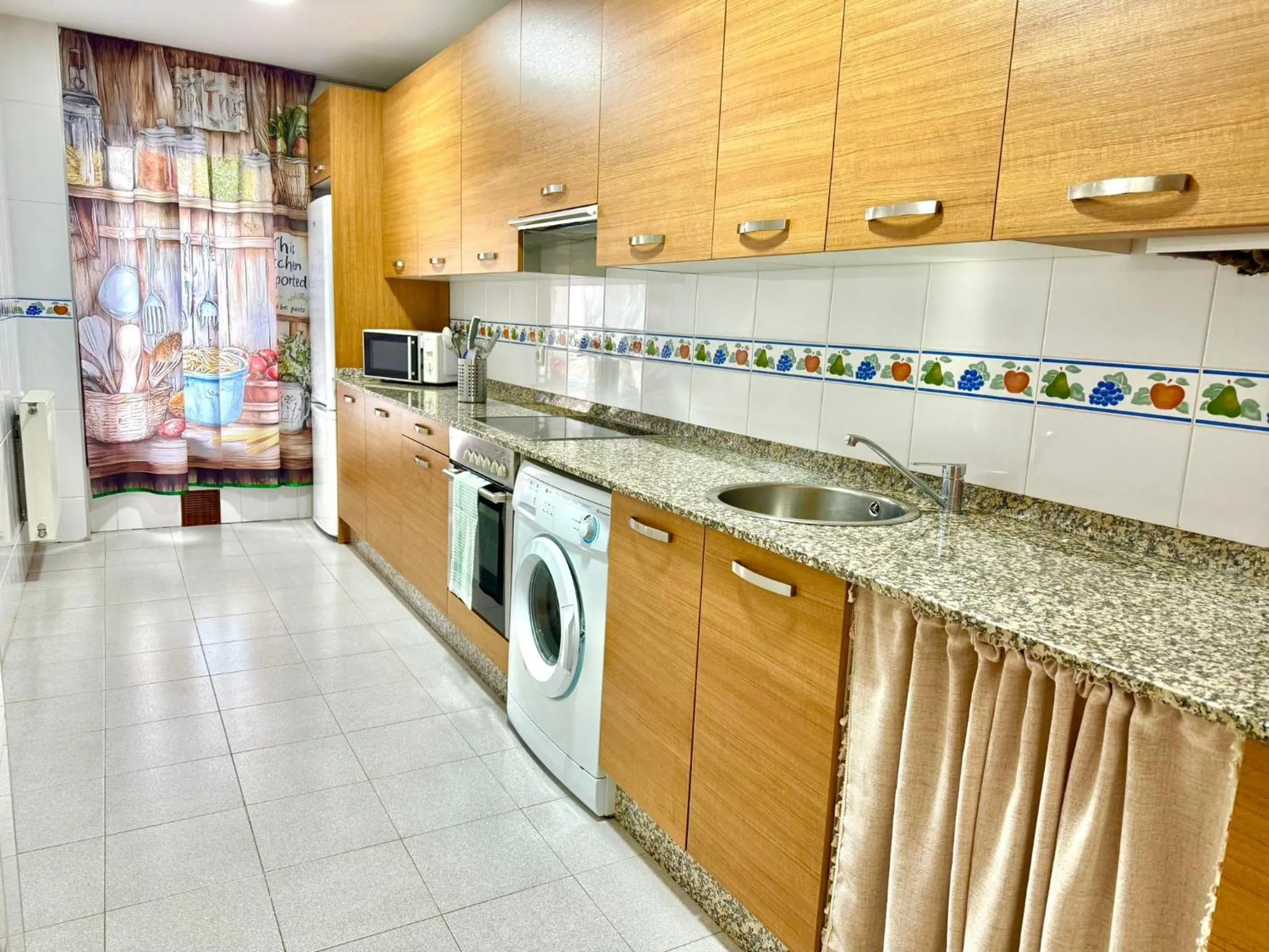 Kitchen or kitchenette in Apartamentos El Caxigu