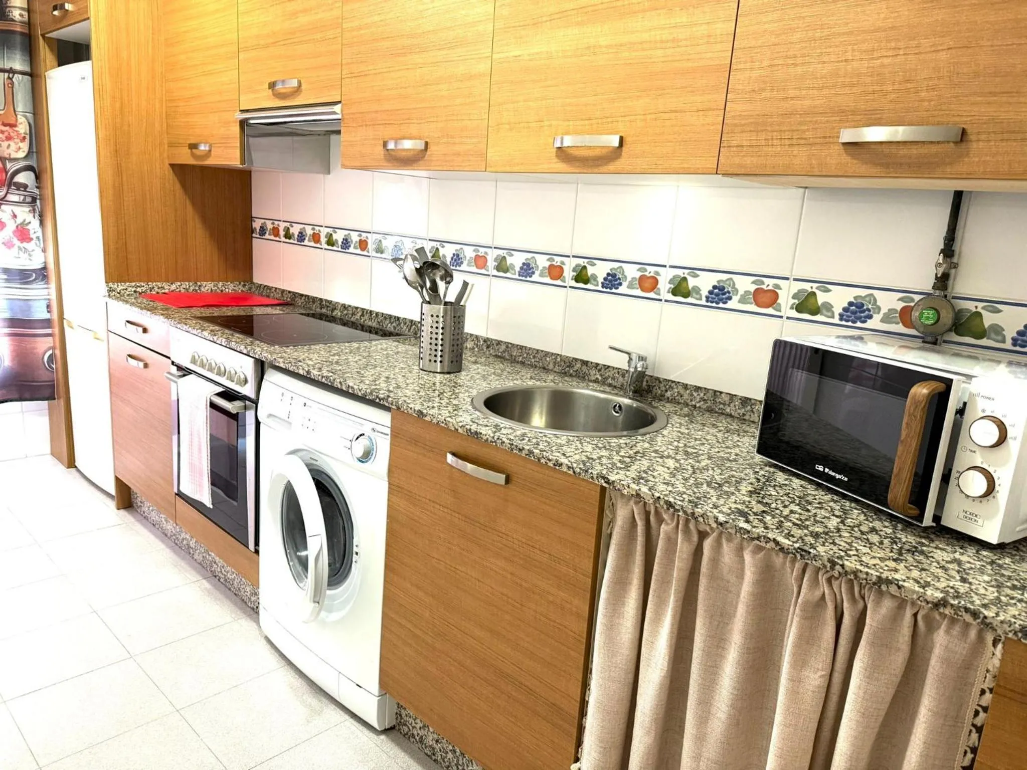 Kitchen or kitchenette in Apartamentos El Caxigu