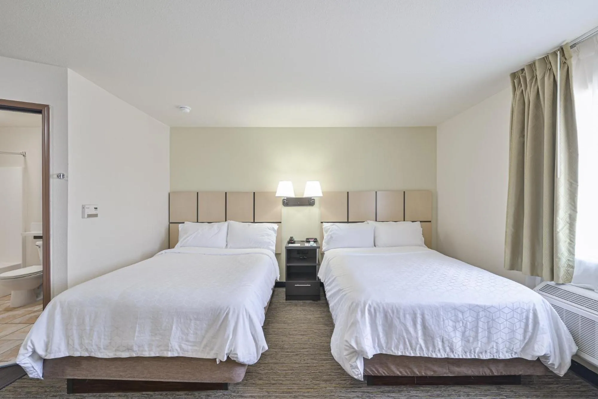 Bed in Affordable Suites of America Tulsa