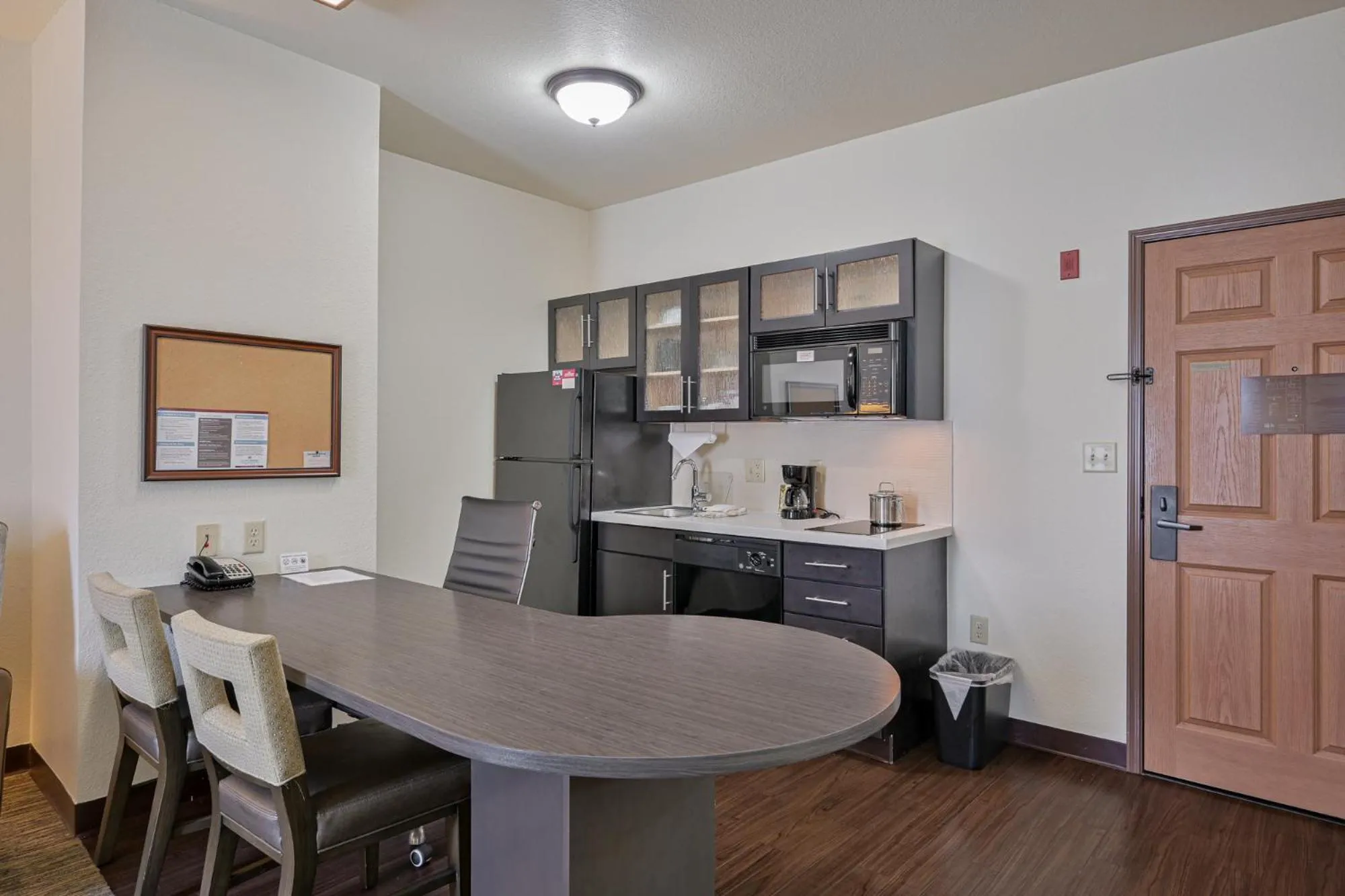 Kitchen or kitchenette in Affordable Suites of America Tulsa