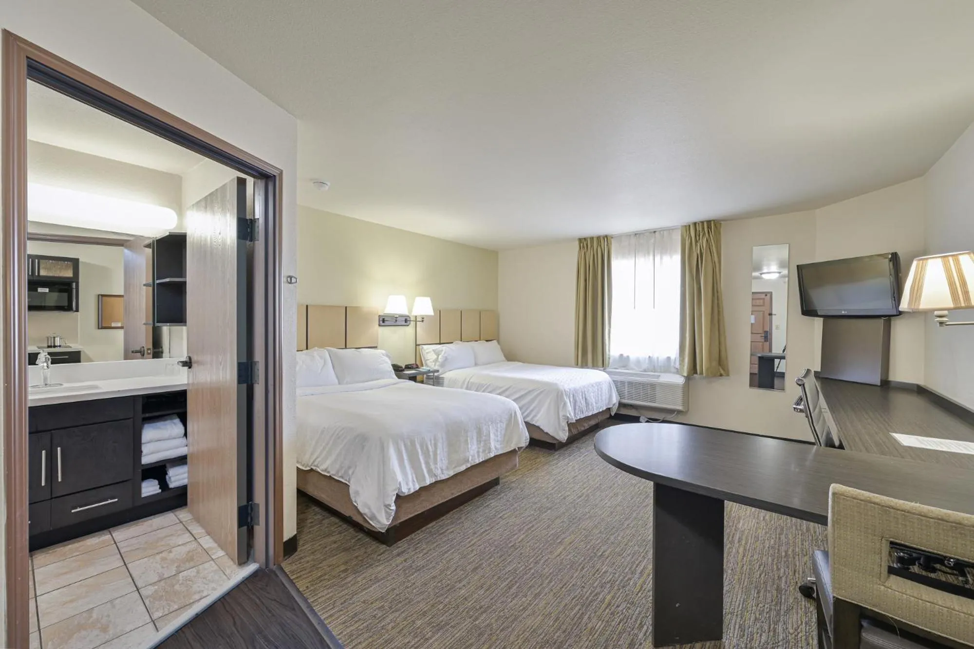 Photo of the whole room, Bed in Affordable Suites of America Tulsa