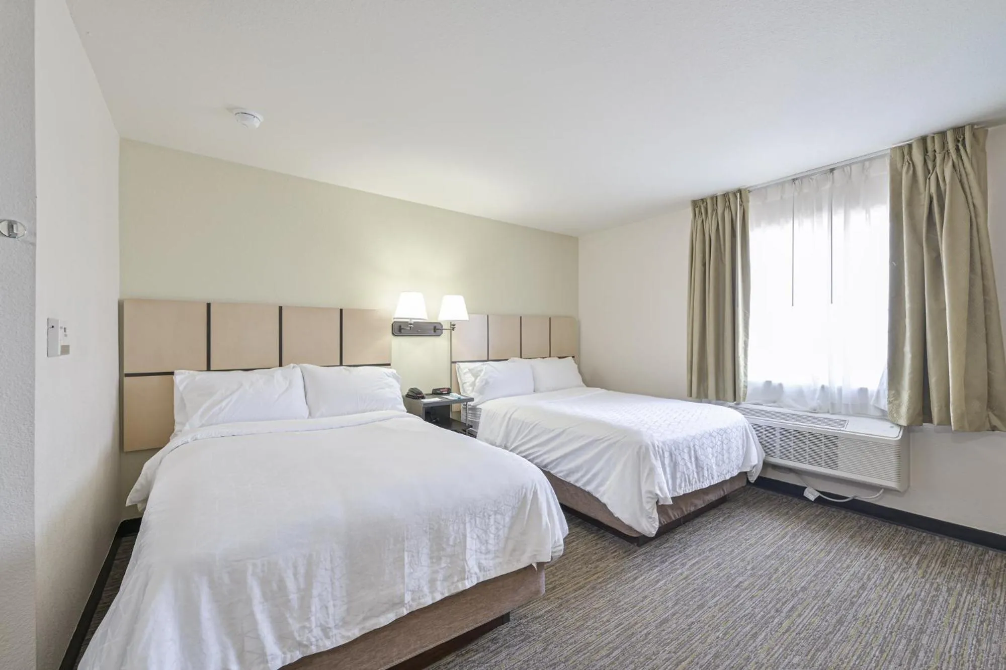 Bed in Affordable Suites of America Tulsa