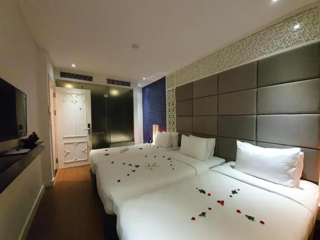 Bed in Le Petit Prince Lakeside Hotel & Rooftop Bar