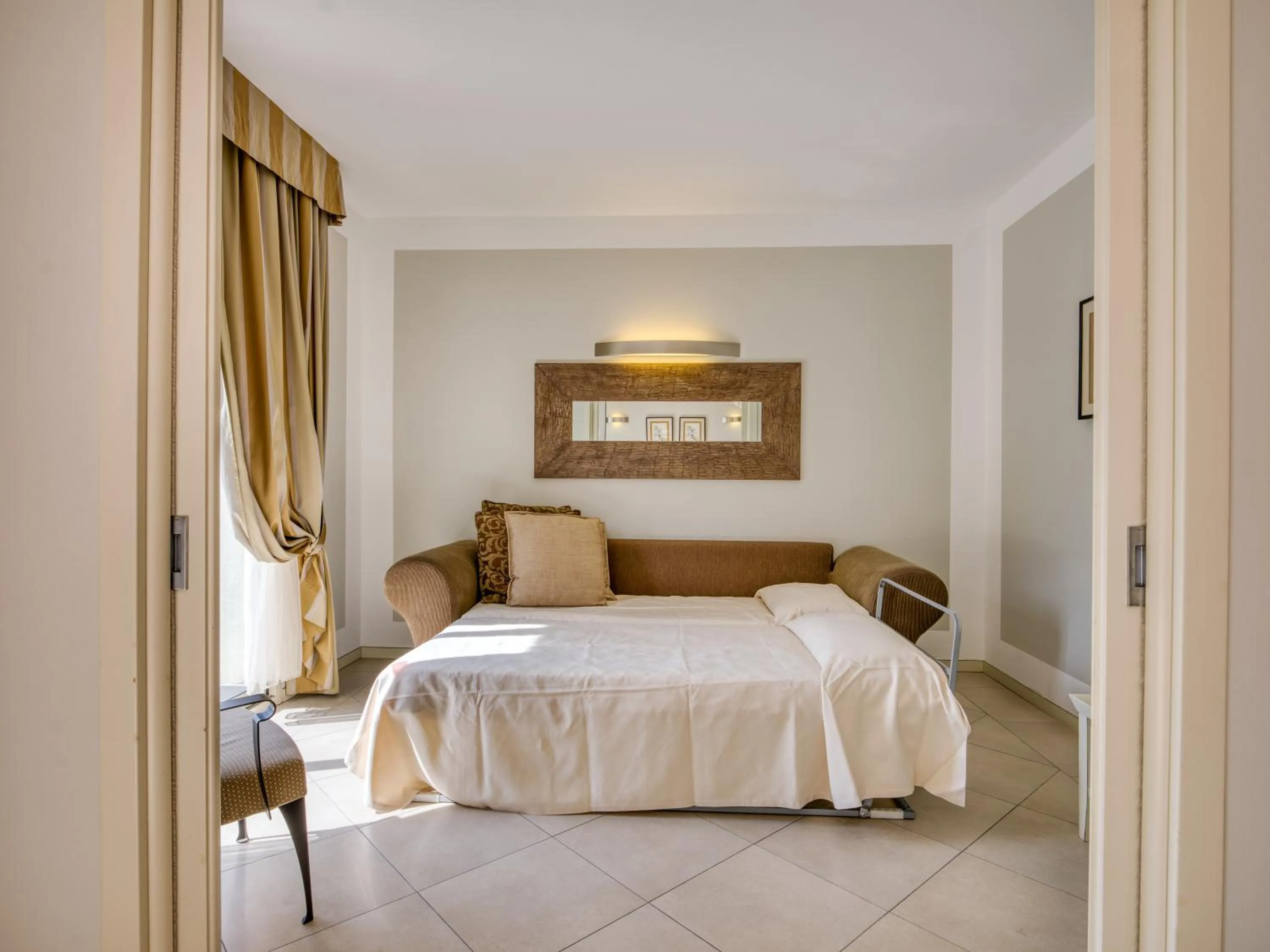 Bed in Parc Hotel Germano Suites & Apartments