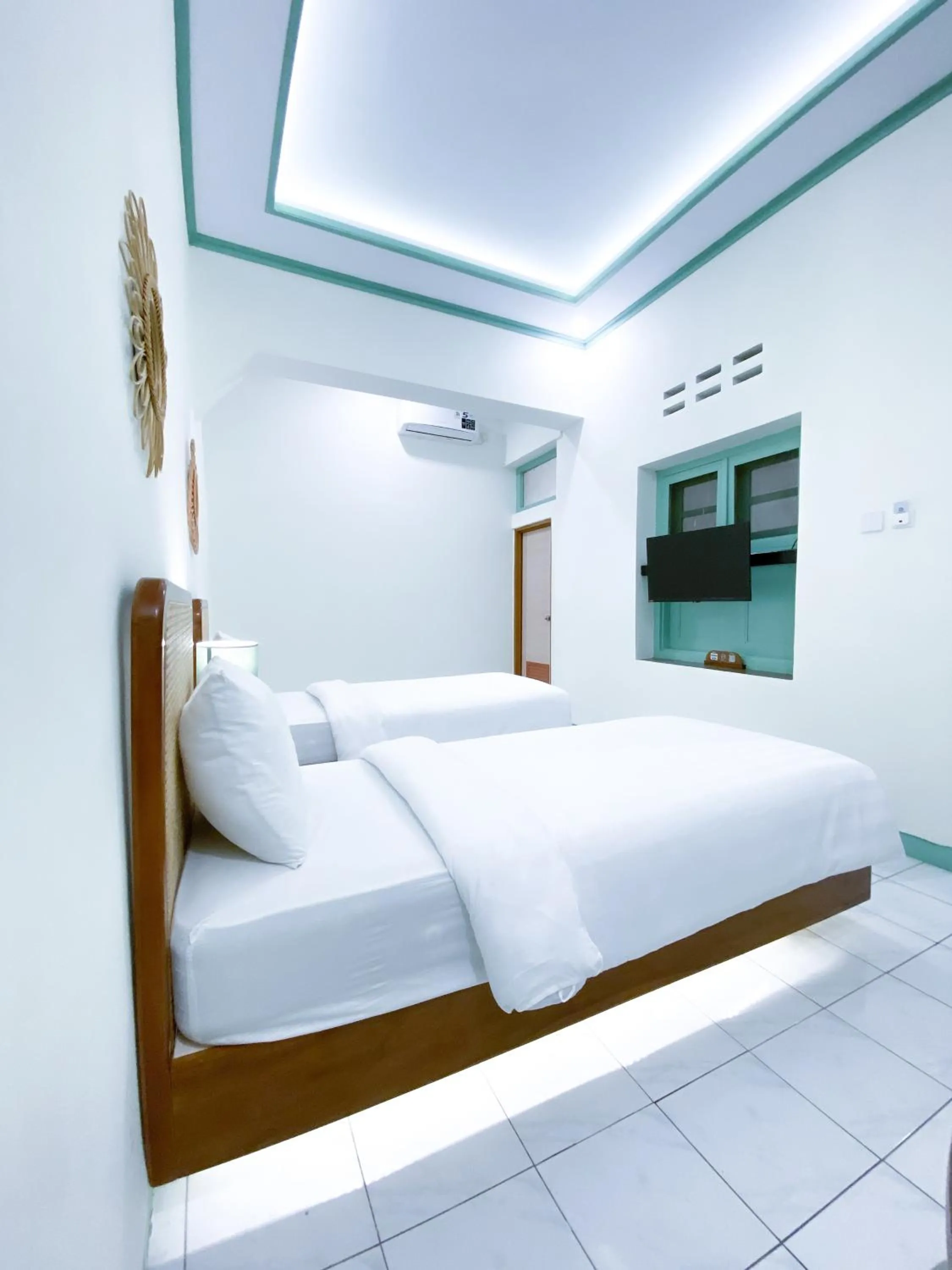 Bed in The Utara Hotel Tugu by Eresha Hospitality