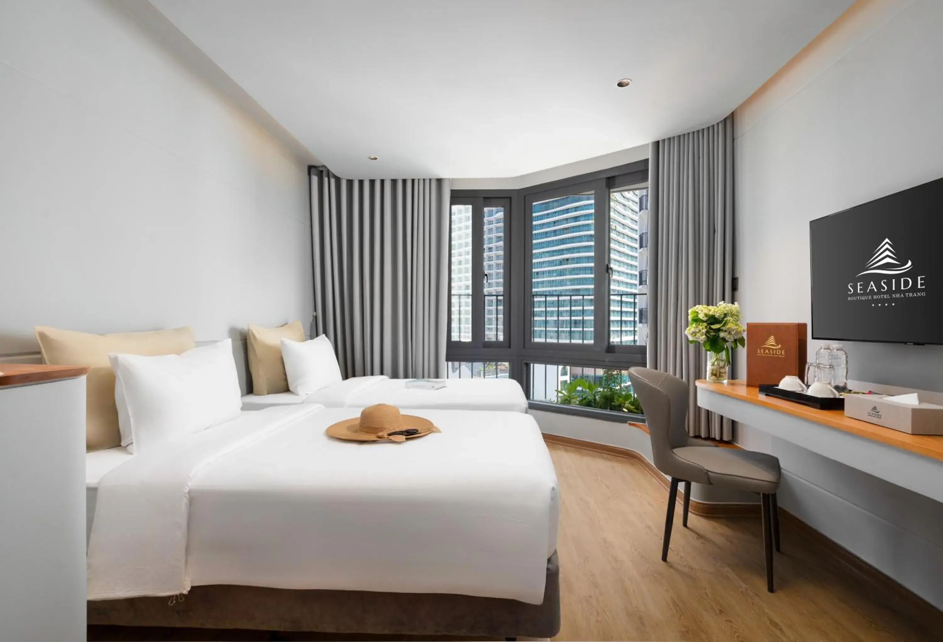Senior Deluxe Double/ Twin room window city view in Seaside Boutique Hotel Nha Trang Beach Senior Deluxe Double/ Twin room window city view in Seaside Boutique Hotel Nha Trang Beach